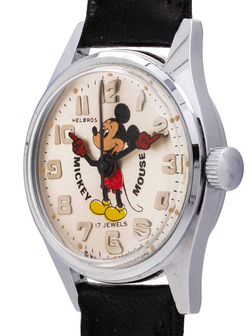 
Vintage, small size Helbros 17 jewel manual wind Mickey Mouse watch circa 1970’s. Featuring 28mm diameter base metal case with steel screw down back, with acrylic crystal, and with excellent condition original dial with polychrome depiction of