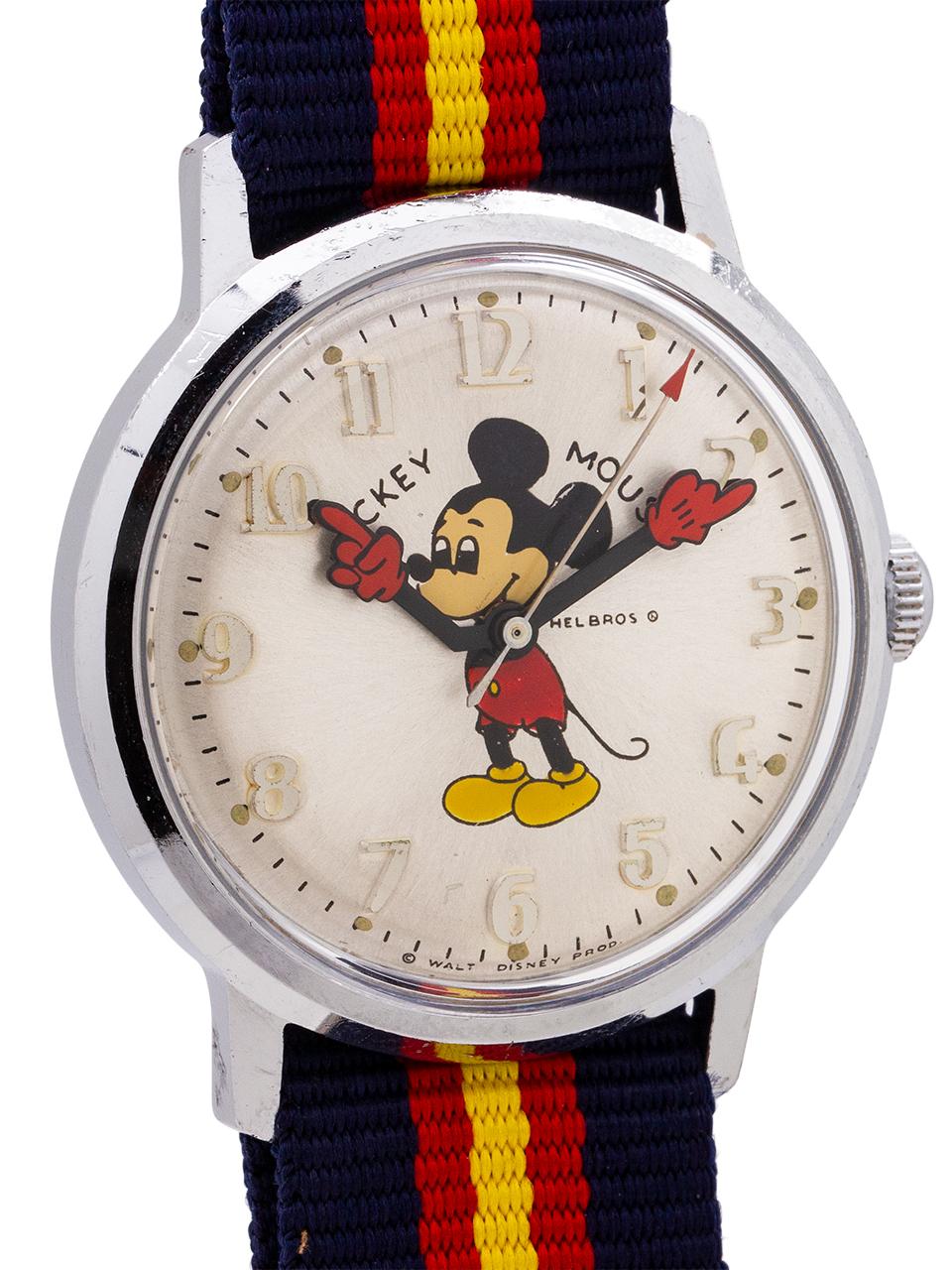 
Vintage Helbros 17 jewel manual wind Mickey Mouse watch circa 1970’s. Featuring 34mm diameter base metal case with steel screw down stainless steel back, with acrylic crystal, and with excellent condition original dial with polychrome depiction of