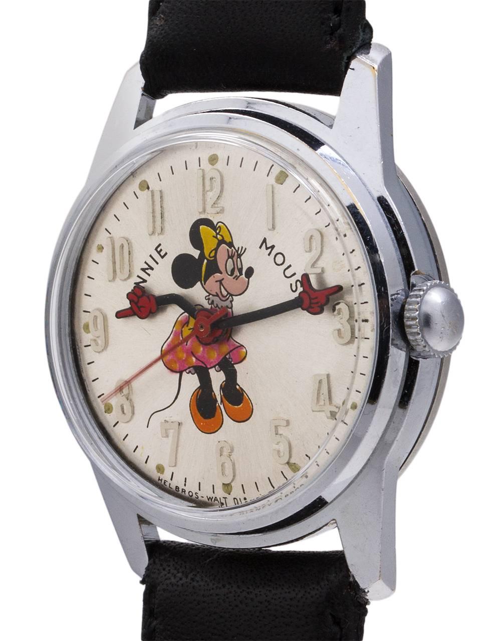 
Vintage medium size Helbros 17 jewel manual wind Minnie Mouse watch circa 1970’s. Featuring 31mm diameter chromium plated case with steel screw down back, with acrylic crystal, and with excellent condition original dial with polychrome depiction of