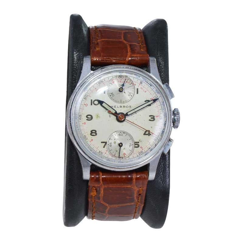 FACTORY / HOUSE: Helbros Watch Company
STYLE / REFERENCE: Art Deco Two Register Chronograph
METAL / MATERIAL: Stainless Steel
CIRCA / YEAR: 1940's
DIMENSIONS / SIZE: Length 38mm X Diameter 32mm
MOVEMENT / CALIBER: Winding / 17 Jewels 
DIAL / HANDS: