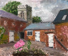 Charming English Courtyard Scene with Church Tower and Brick Buildings