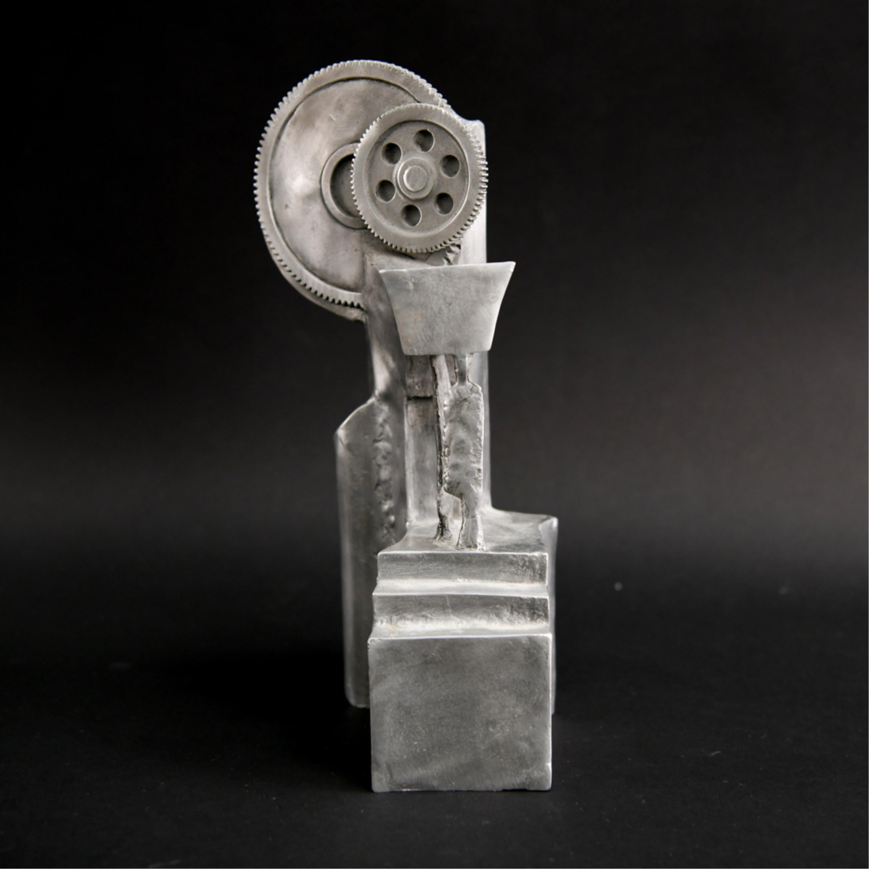 This Machine Age aluminium sculpture with a slate base is titled 