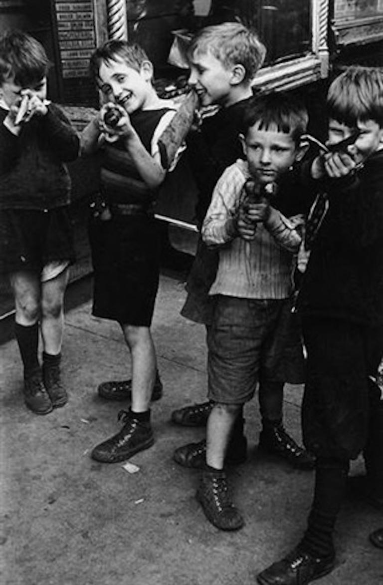 VINTAGE, Signed. Excellent Condition.

Photojournalistic, New York, Vintage, Black and White, Rare, Boys, Children, Gun, Guns, Play.

Helen Levitt  (1913-2009)

Helen Levitt's playful and poetic photographs, made over the course of sixty years on