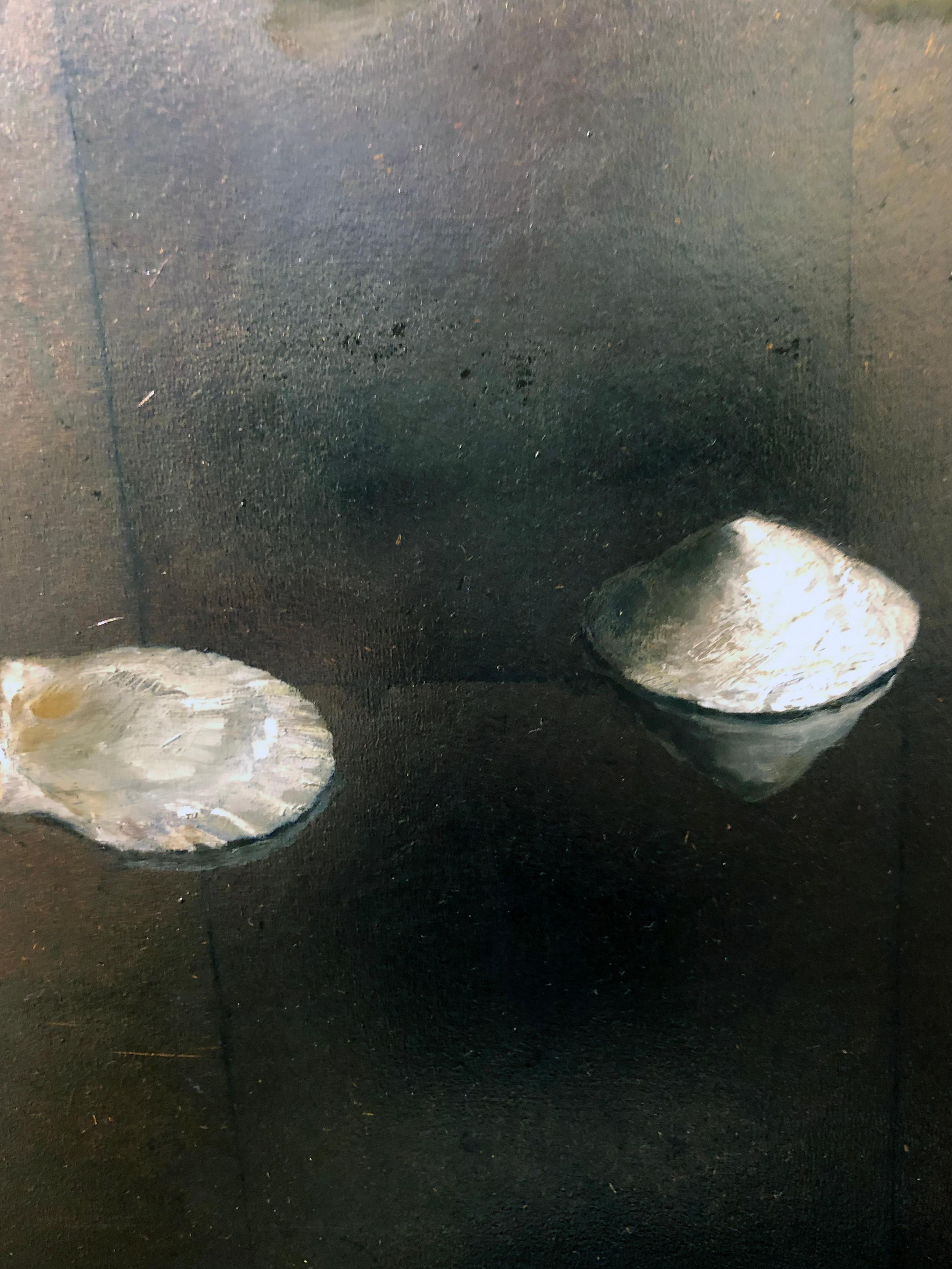 This delicately rendered painting presents the viewer with a collection of objects to contemplate.  A circle of 12 sea shells are arranged atop a reflective surface.  Placed in a circle, the shells have gathered, as if for a ceremony, or a dance. 