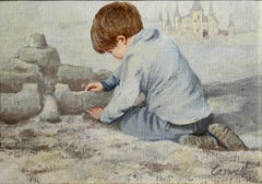 Boy building a Sand Castle