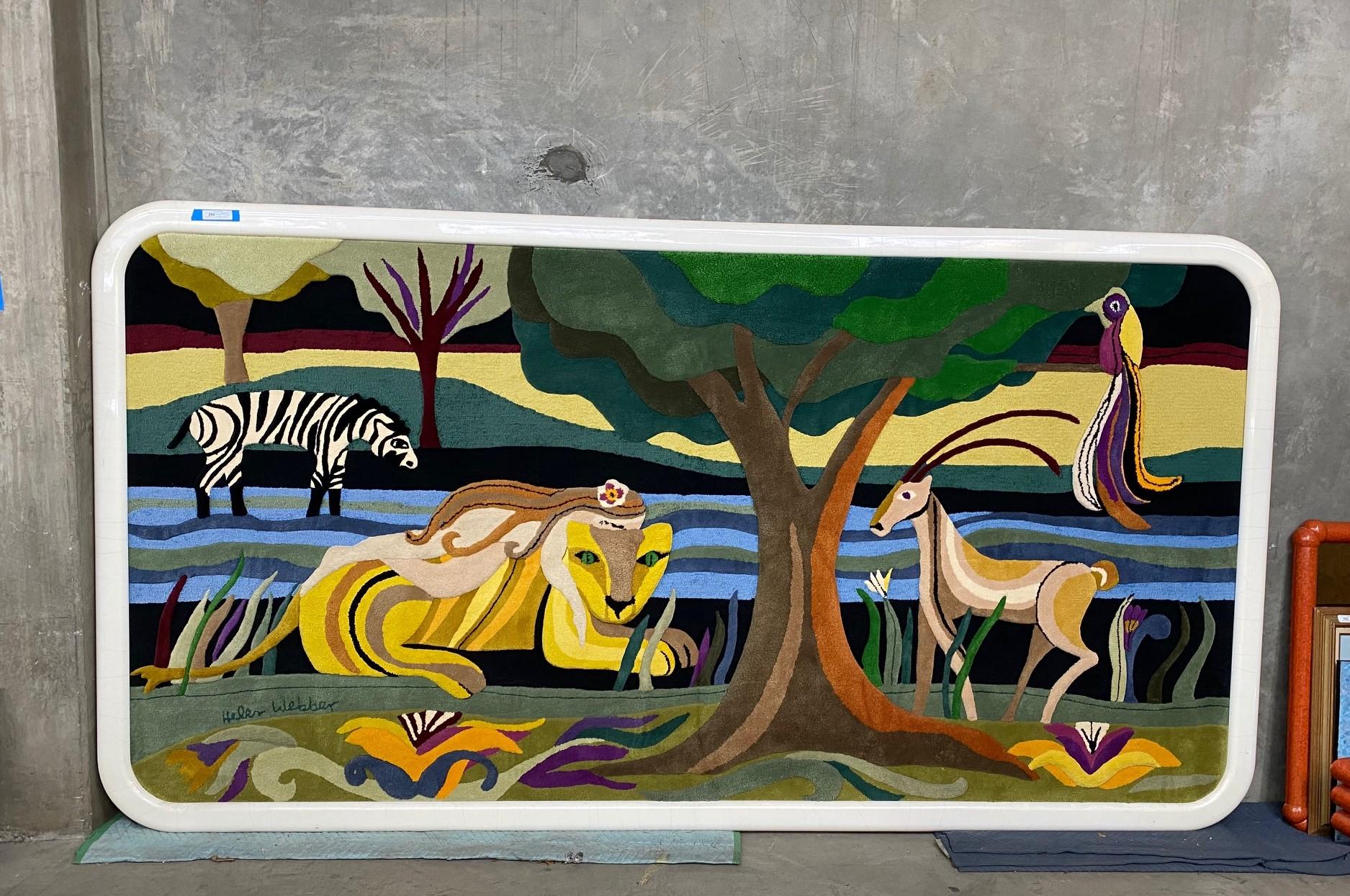 A truly stunning, one-of-a-kind work by California master tapestry artist Helen Webber featuring various wild natural creatures in an African jungle scene. The colors are so rich and vibrant. This, without question, is one of the most wonderful