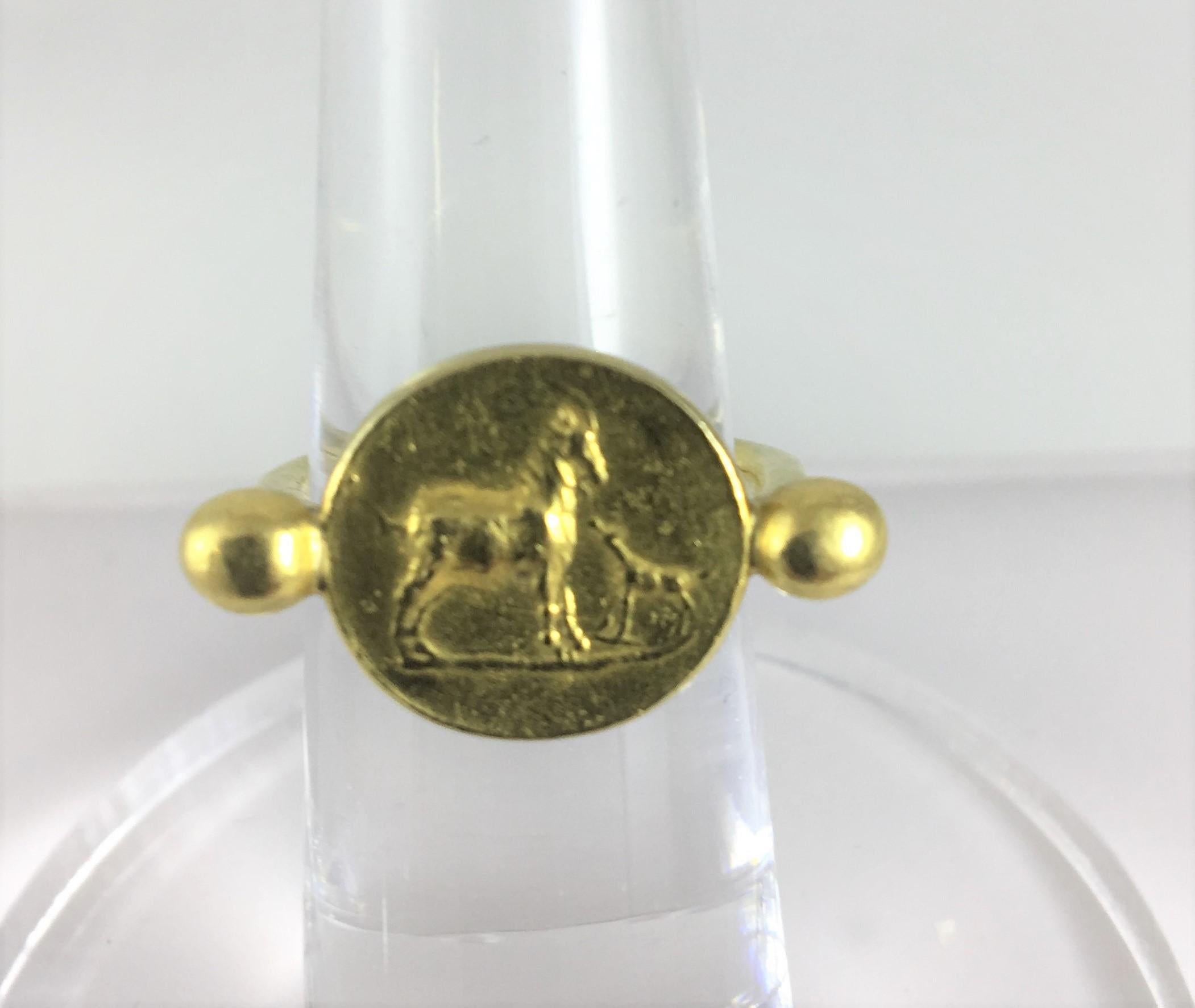 Helen Woodhull, New York City
22K yellow gold ring 
Raised Roman-style Horse and Foal Motif 
Circa 1970's
Size 6