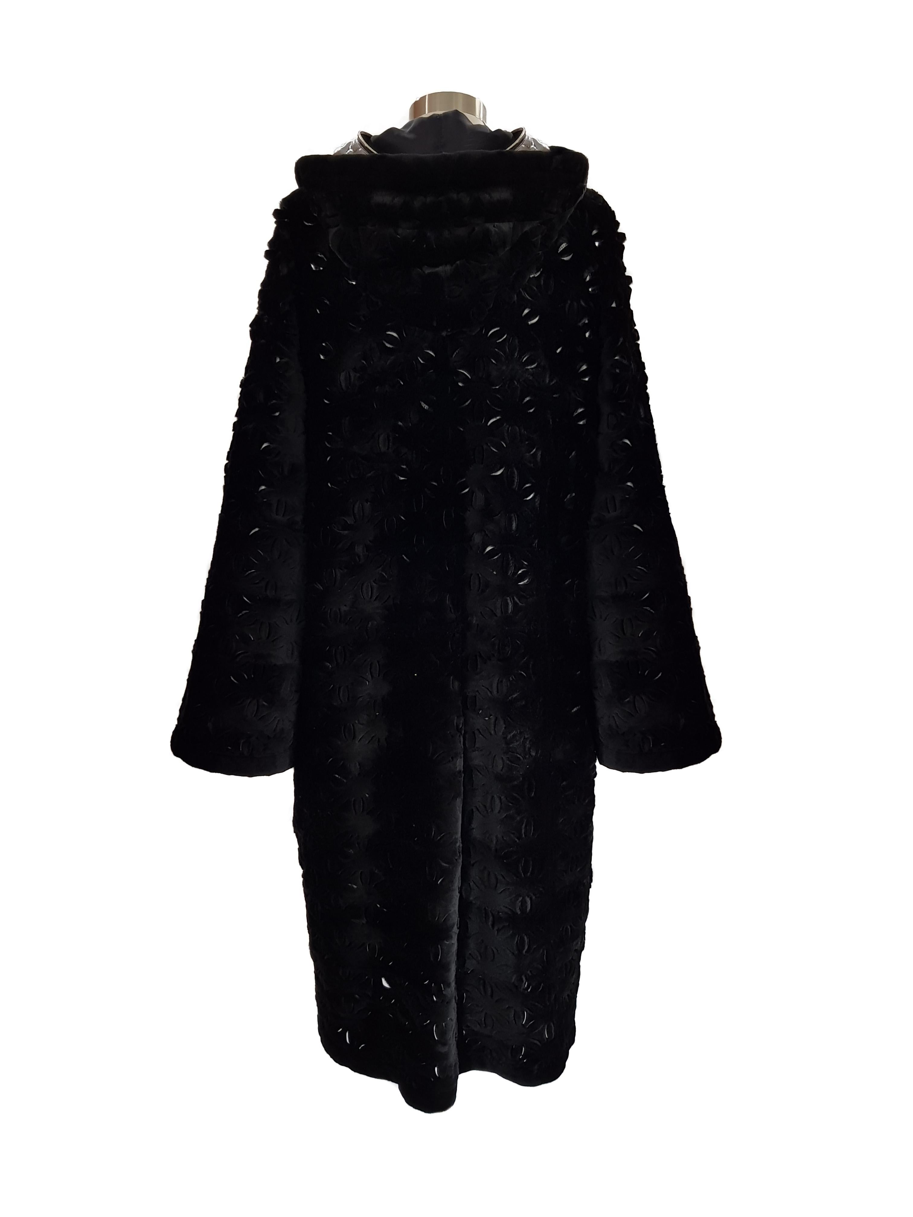 Reversible hooded dyed sheared mink coat with snap closure. Silver rain detachable lining.