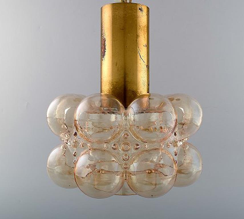 Helena Tynell (b. 1918, d. 2016) for Limburg. Glass pendant, Model: Bubble. Finnish design, 1970's. Brass construction with bubble-shaped smoke colored mouth blown art glass.
Height: 29 cm.
Diameter: 25 cm.
In very good condition.

Helena