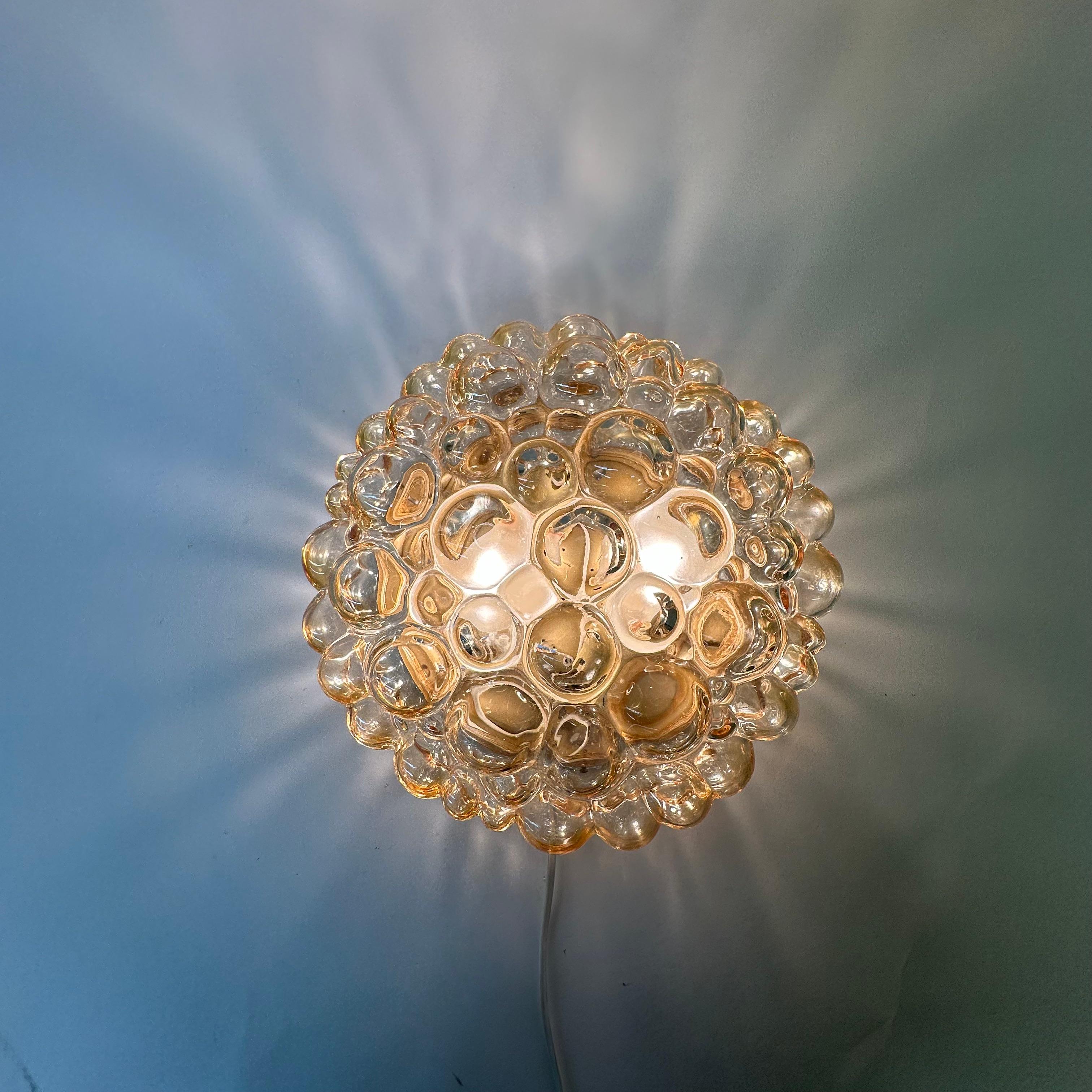 Helena tynell bubble glass flush mount ceiling lamp , 1970’s Germany

Dimensions: 30cm Diameter , 13cm Height
Condition: Good
Material: Glass , metal
Color: Gold
Manufacturer: Helena Tynell