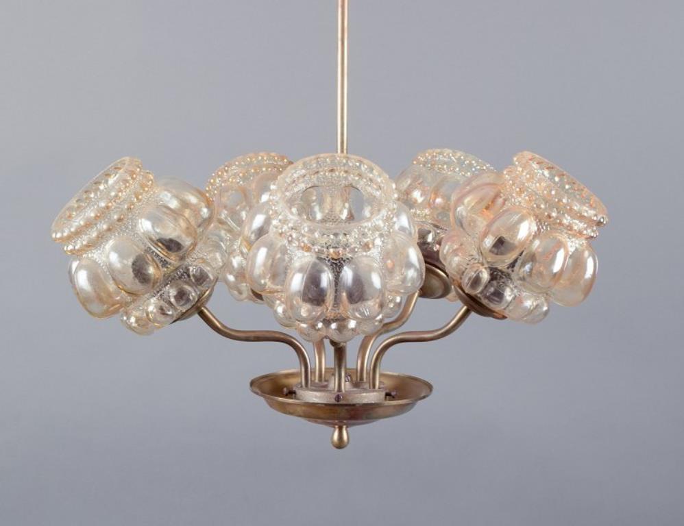 Finlandese Helena Tynell. Lampada da soffitto a cinque bracci in ottone. 1970s in vendita