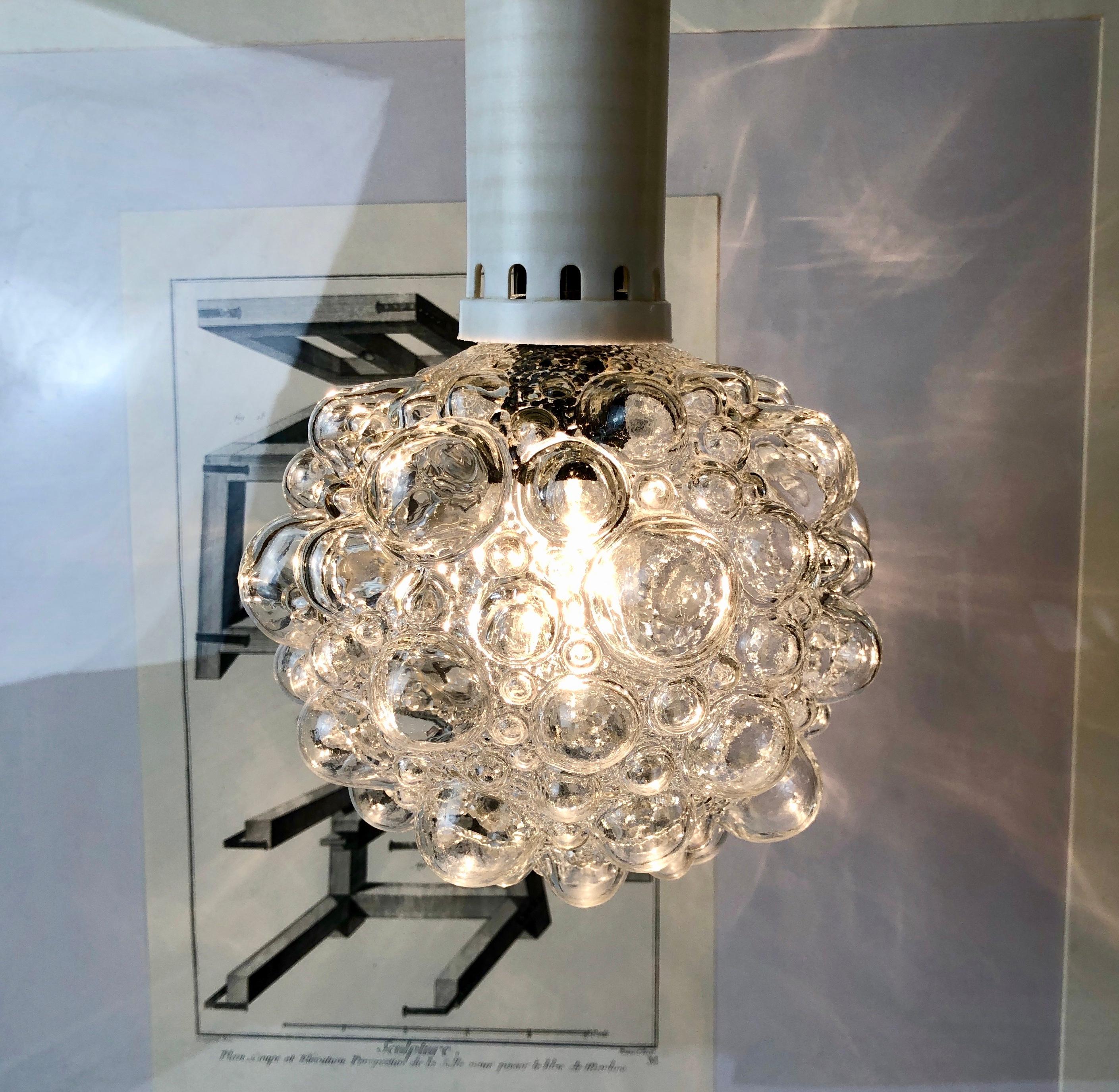 Beautifully designed small pendant lamp by Finnish mid-century artist Helena Tynell for Limburger Glashuette, Germany.
The design for this very lamp is around 1959.
I assume, this is one of the very first bubble lamps Helena Tynell designed.
Large