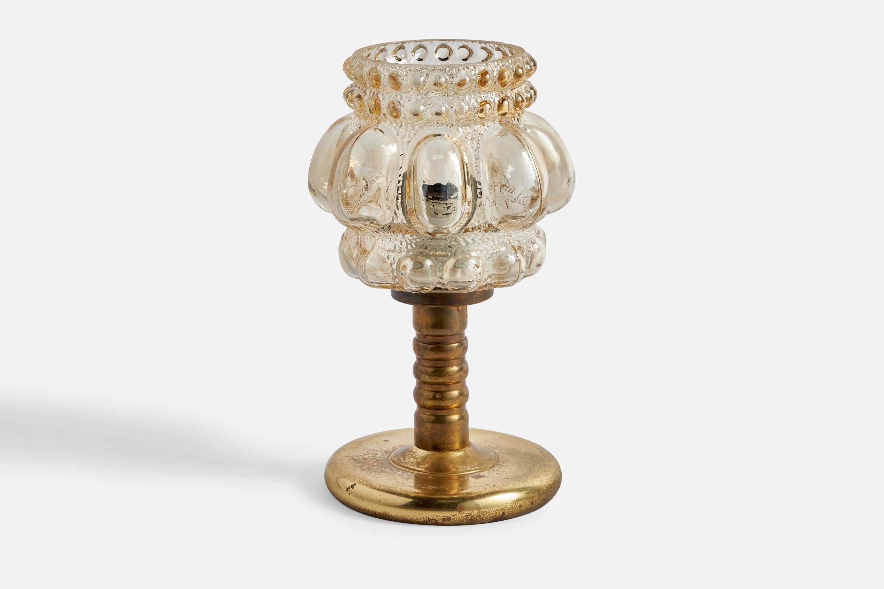 A glass and brass table lamp designed by Helena Tynell and produced by Glashütte Limburg, Germany, c. 1960s.

Overall Dimensions (inches): 9.55” H x 5.65” Diameter
Bulb Specifications: E-26 Bulb
Number of Sockets: 1
All lighting will be converted
