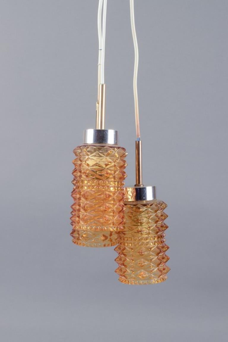 Helena Tynell. Three small ceiling lamps in stainless steel and smoke-colored glass.
Approximately from 1970.
In perfect condition.
Dimensions: H 20.0 cm x D 7.0 cm.

Helena Tynell was a renowned Finnish glass artist, most famously associated with