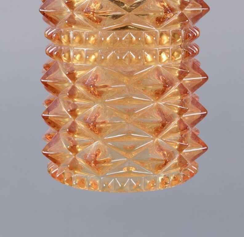 Finnish Helena Tynell. Three ceiling lamps. Stainless steel and smoke-colored glass For Sale