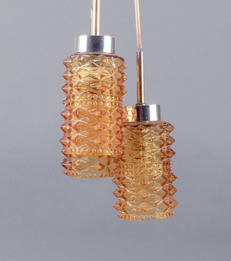 Helena Tynell. Three ceiling lamps. Stainless steel and smoke-colored glass In Excellent Condition For Sale In Copenhagen, DK