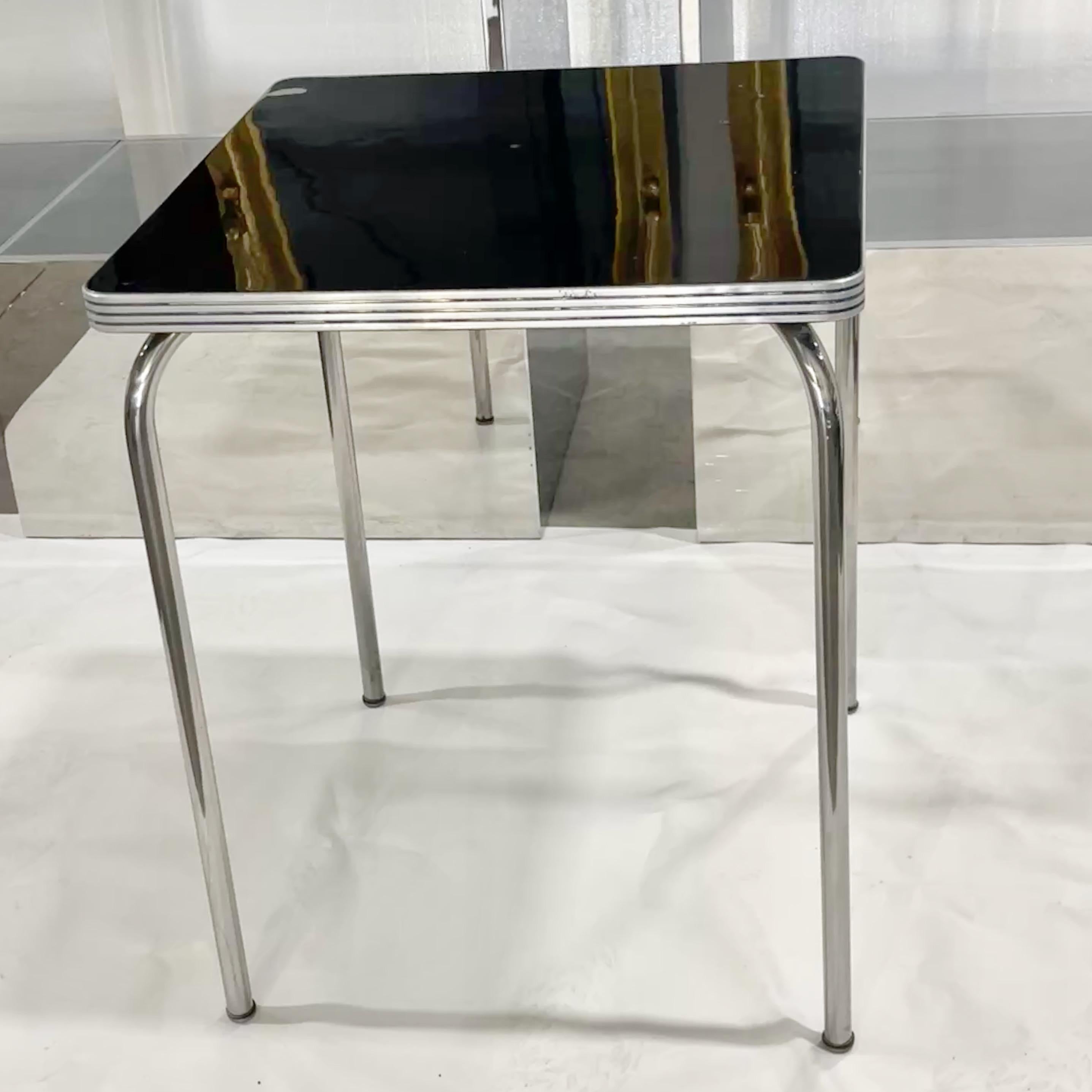 Please note this table can be flat packed so ask us for a shipping quote.
Charming original Bauhaus style square table in the style of Gilbert Rohde produced by Helene Curtis Industries division of National Minerals Corp of bent chrome plated