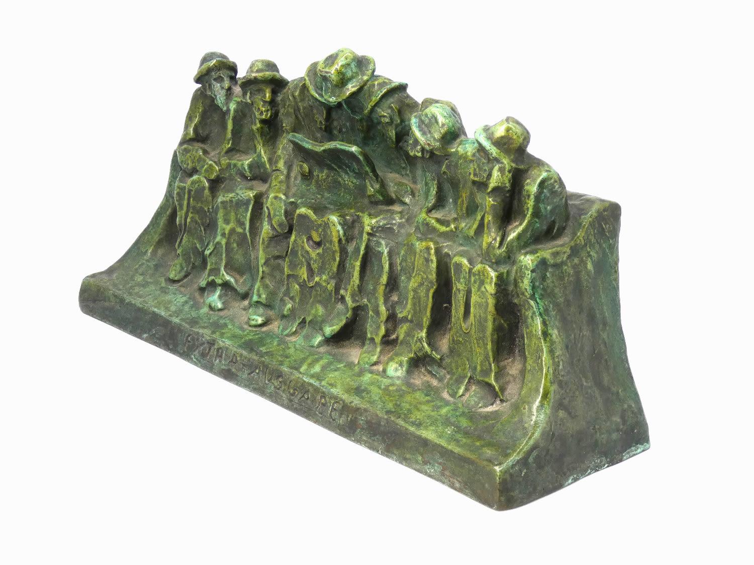 HÉLÈNE ZELEZNY-SCHOLTZ (1882-1974). A bronze sculpture “Reading of the newspaper”, 1915.

A man reads the newspaper for six other men sitting on a bench. The inscription on the base reads “special edition” (Extra- Ausgabe). 1915 has seen intense