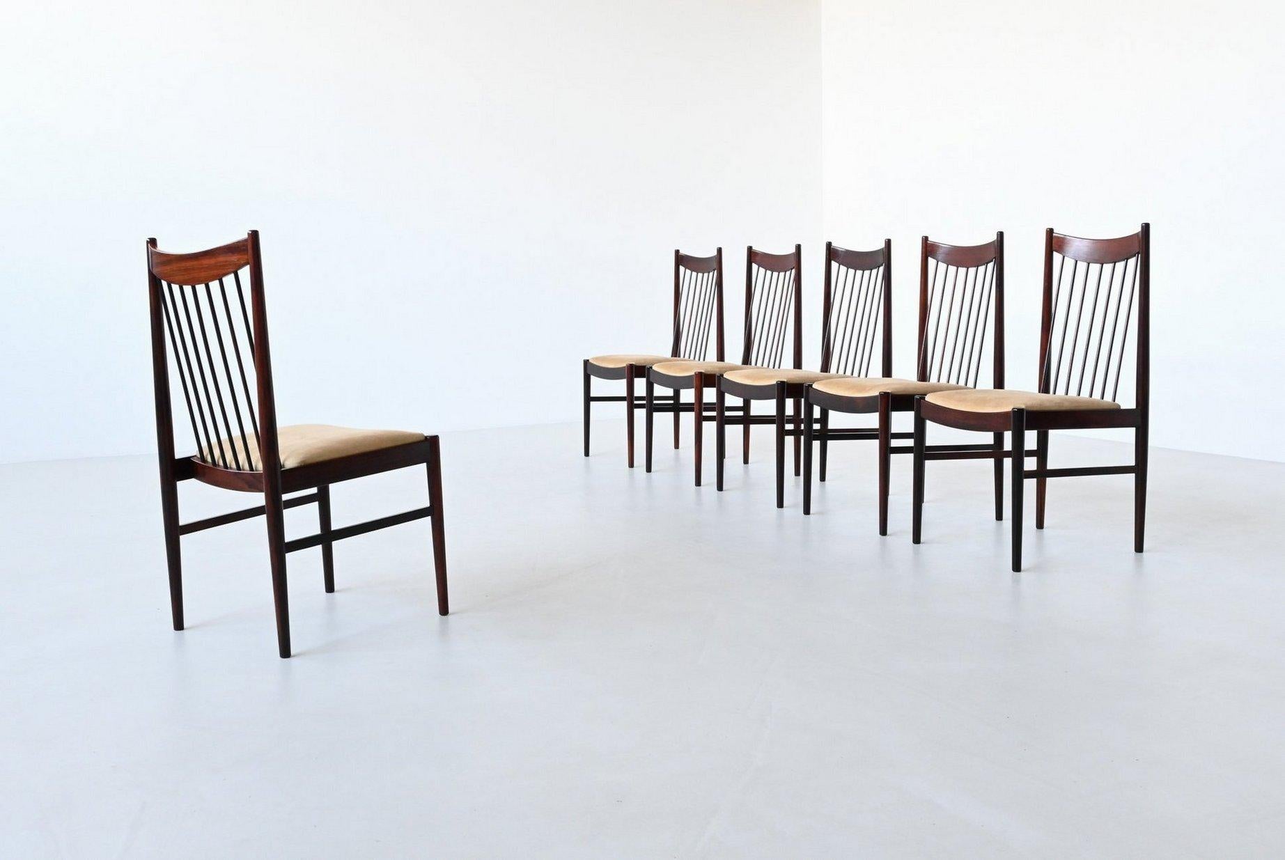 Beautiful shaped set of six dining chairs model 422 designed by Helge Sibast for Sibast Mobler, Denmark 1960. These well-crafted chairs are made of solid rosewood and the seats are upholstered with beige suede fabric. Very nice detailed such as the