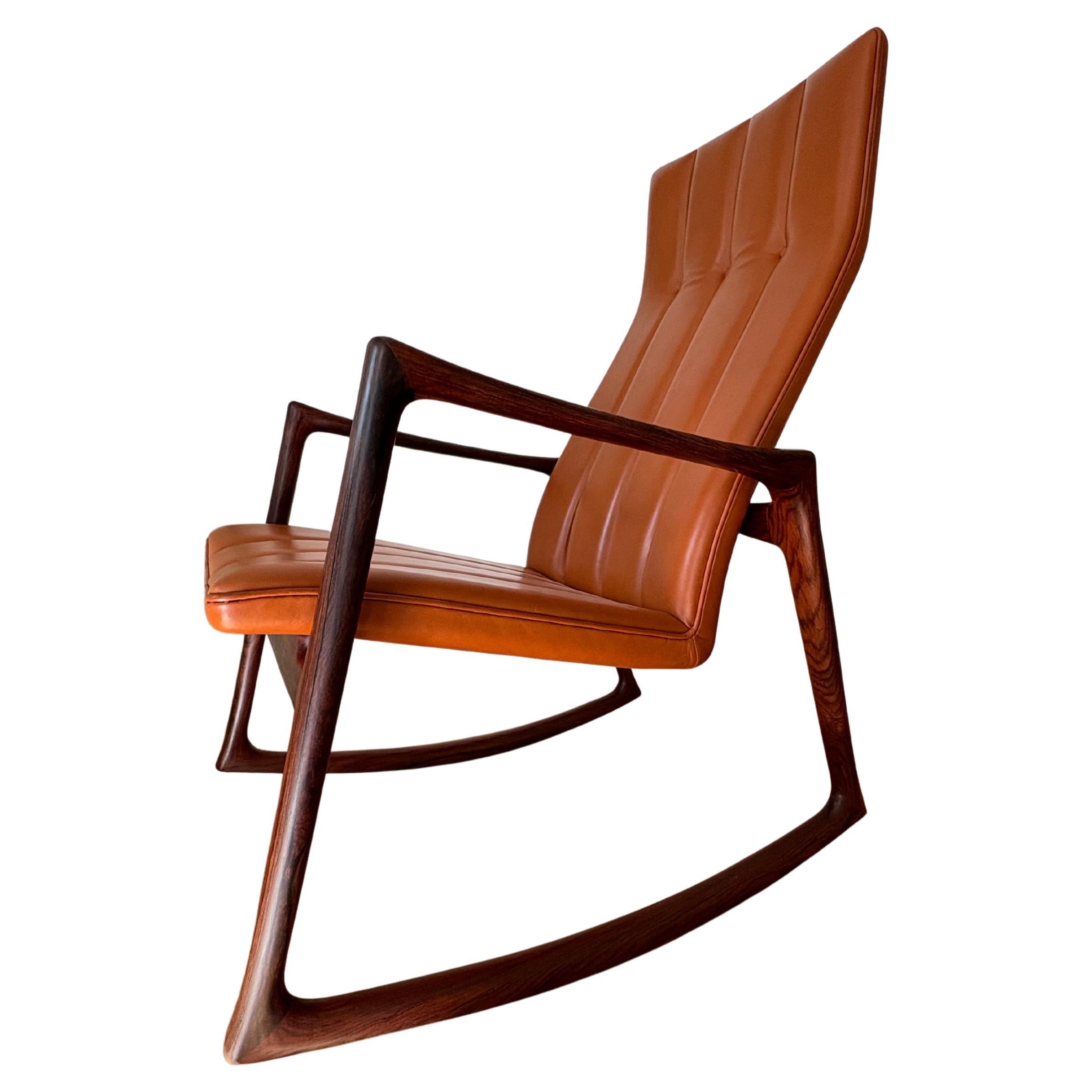 Designed in 1959 by Helge Vestergaard-Jensen, this rosewood edition was made by the Niels Roth Andersen,  Alderman of the Copenhagen Guild of Furniture Makers from the mid-90s until his retirement in 2016. 

Designed in 1961, Helge Vestergaard