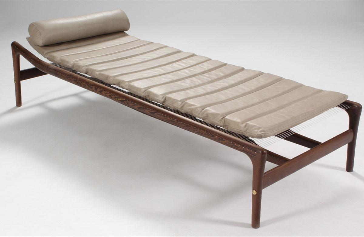 Designed in 1955, Helge Vestergard Jensen’s daybed is a metaphor for the human skeleton. Two spinal columns support a cage of ribs. The legs and arms bend like elbows and knees. The torso is stitched together by 150 meters of nylon cord in place of