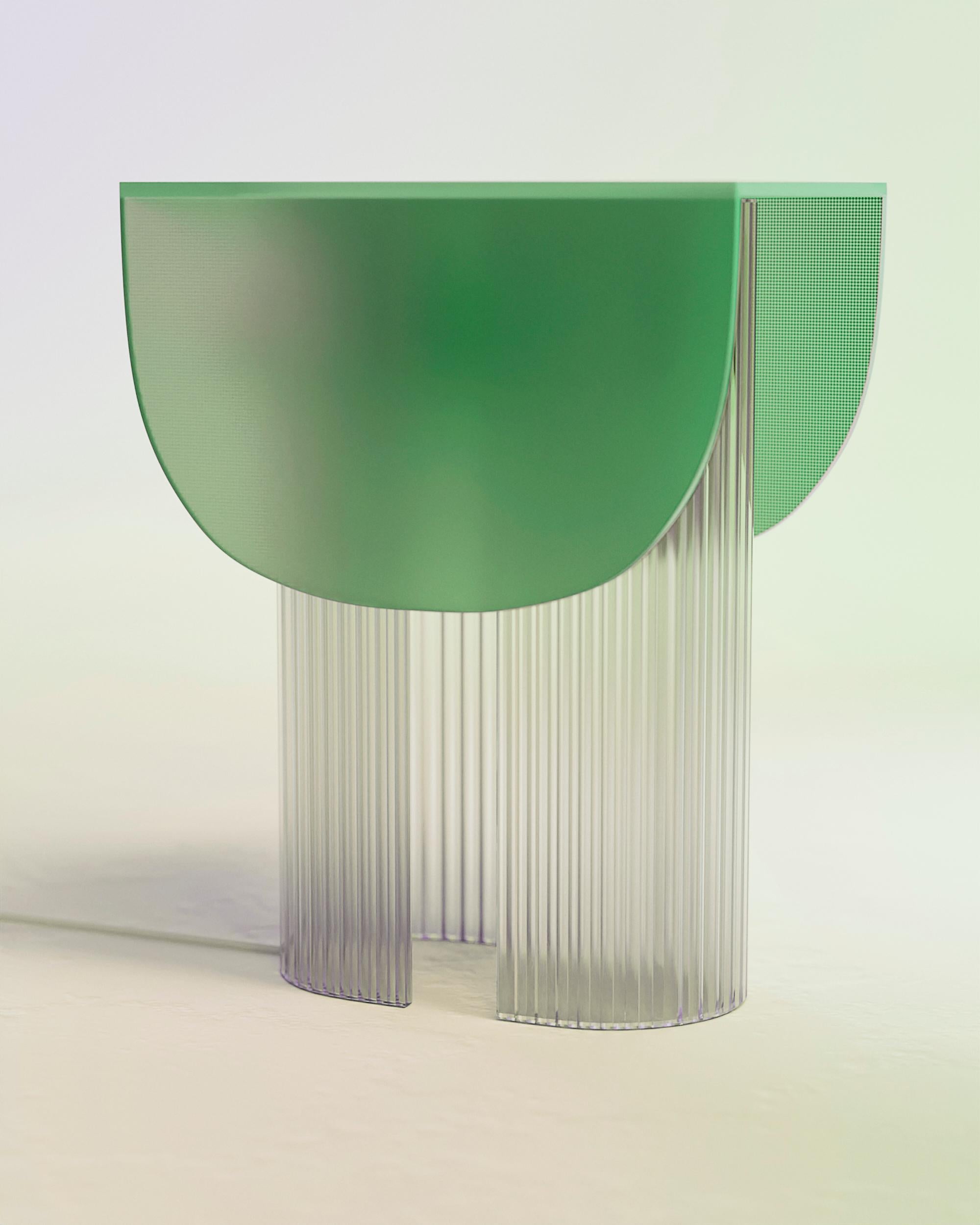 Helia Nature Green Table Lamp by Glass Variations
Designed by Bina Baitel
Dimensions: D 31 x W 22 x H 40 cm.
Materials: Frosted (acid-etched) glass.

Curved feet in patterned and corrugated glass flute. Lampshade in 6 mm tempered glass, matt edges.