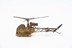 Helicopter miniature in golden silver