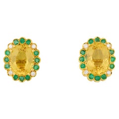 Helidor, Emerald and Diamond Stud Earrings in 18 karat Yellow Gold.