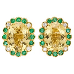 Helidor, Emerald and Diamond Stud Earrings in 18 karat Yellow Gold.