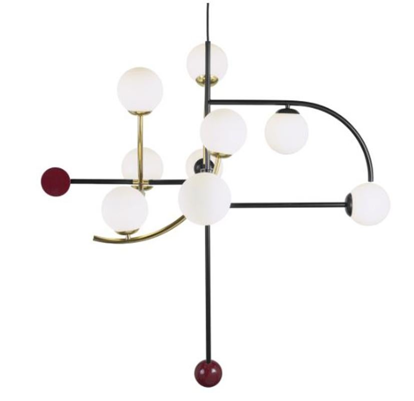 This listing includes: Helio Suspension Lamp + Helio I Suspension Lamp

Part ambient light, part artwork, Helio suspension lamp will highlight any space in all the right ways thanks to its clear glass globe and sleek brass details. Made to Order and