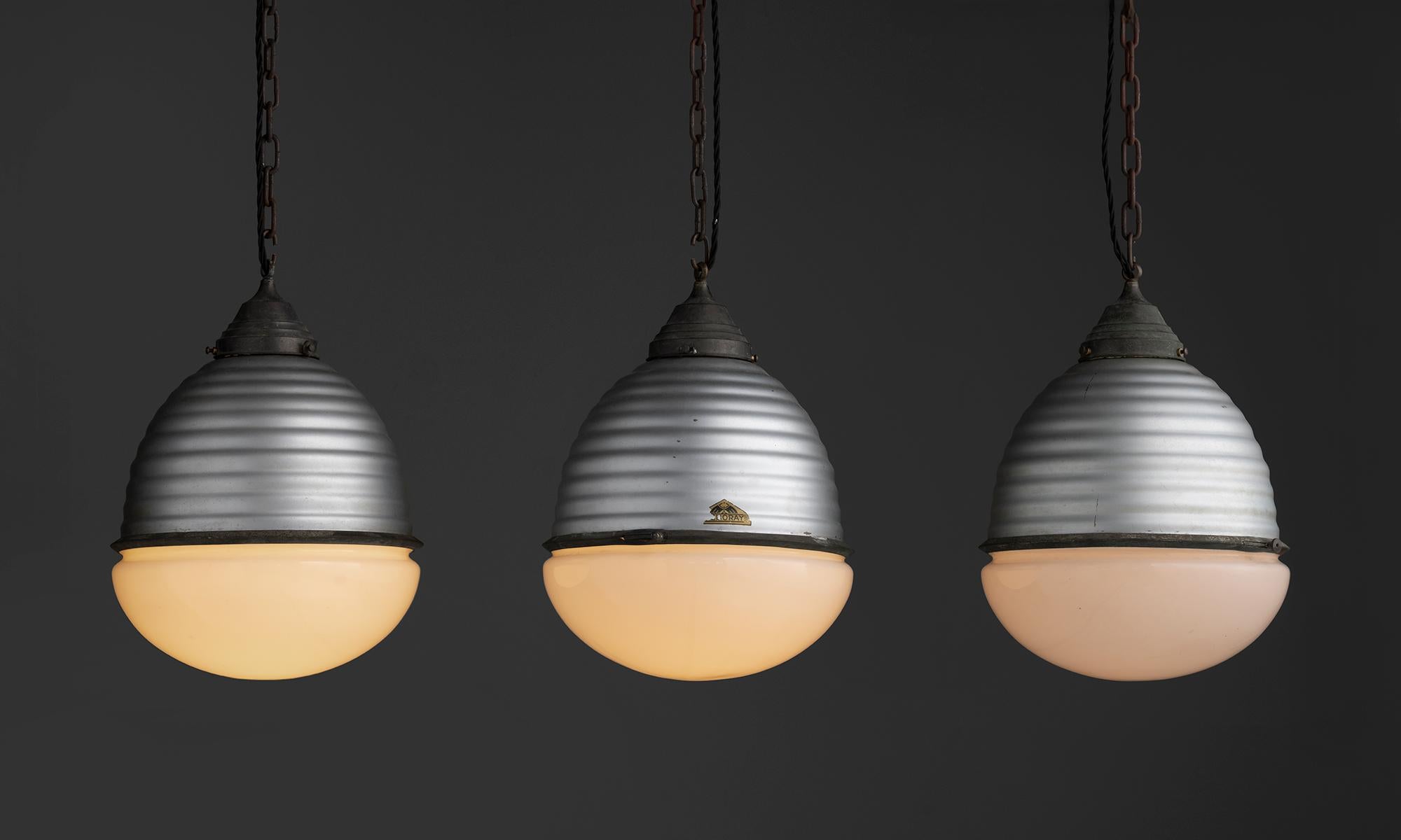 Germany, 1920
Large metal helioray pendants with brass hardware.
13