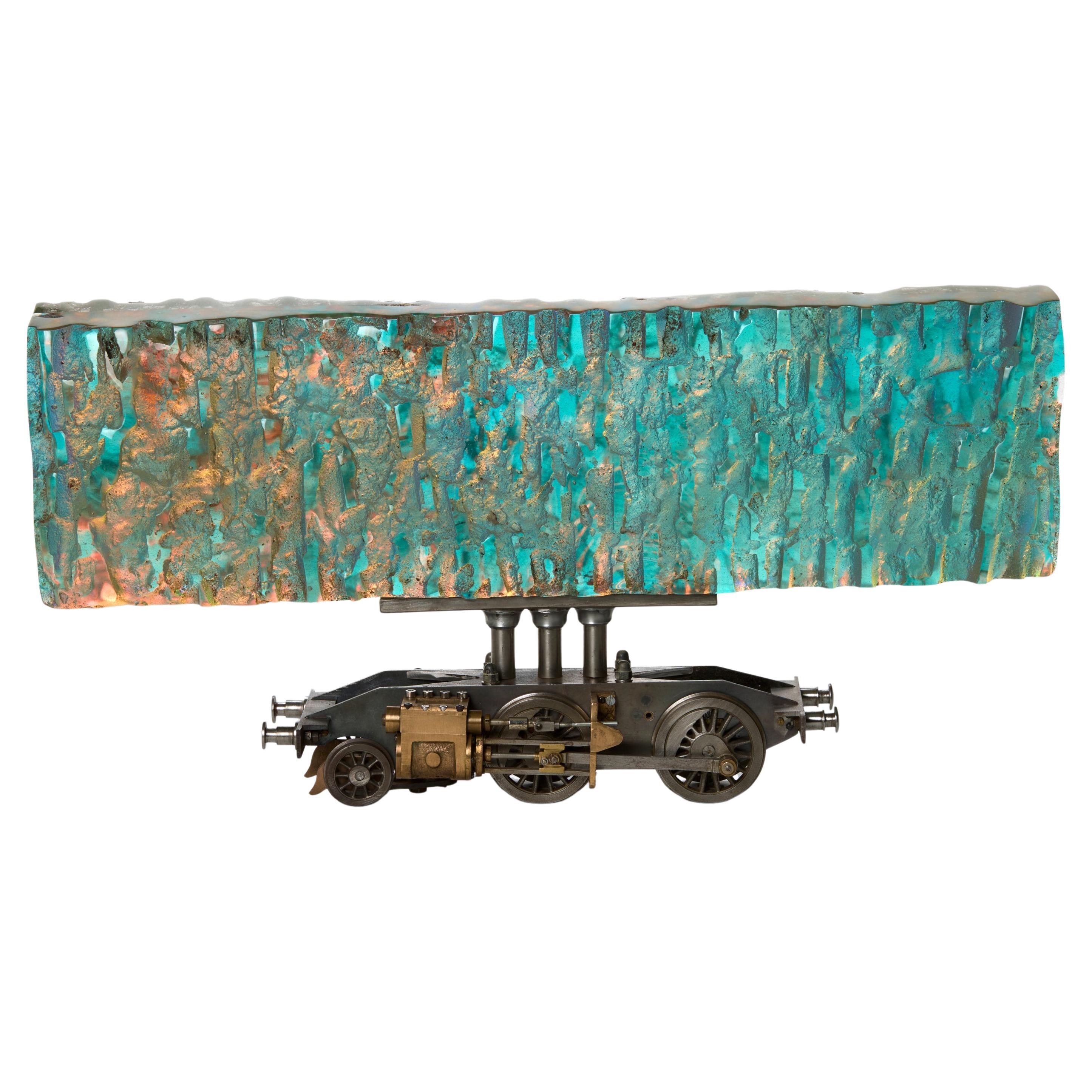 Helios, iridescent cast glass & model train steam chassis sculpture by Jon Lewis