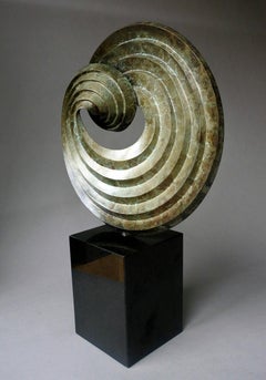 Editioned bronze tabletop sculpture based on forms made by folding pleated paper