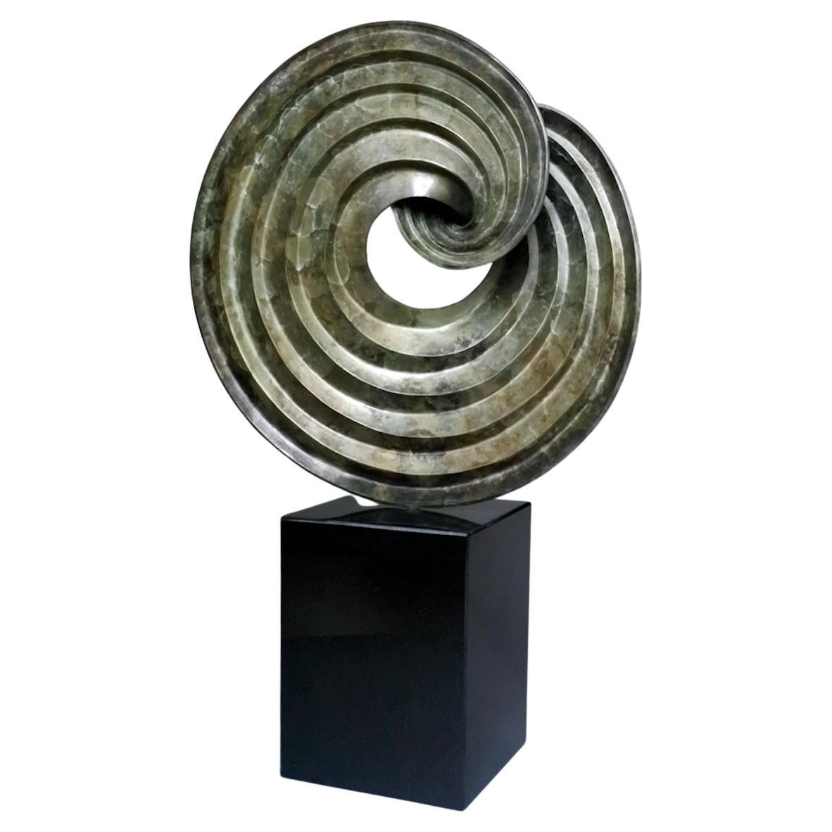 Editioned bronze tabletop sculpture based on forms made by folding pleated paper For Sale