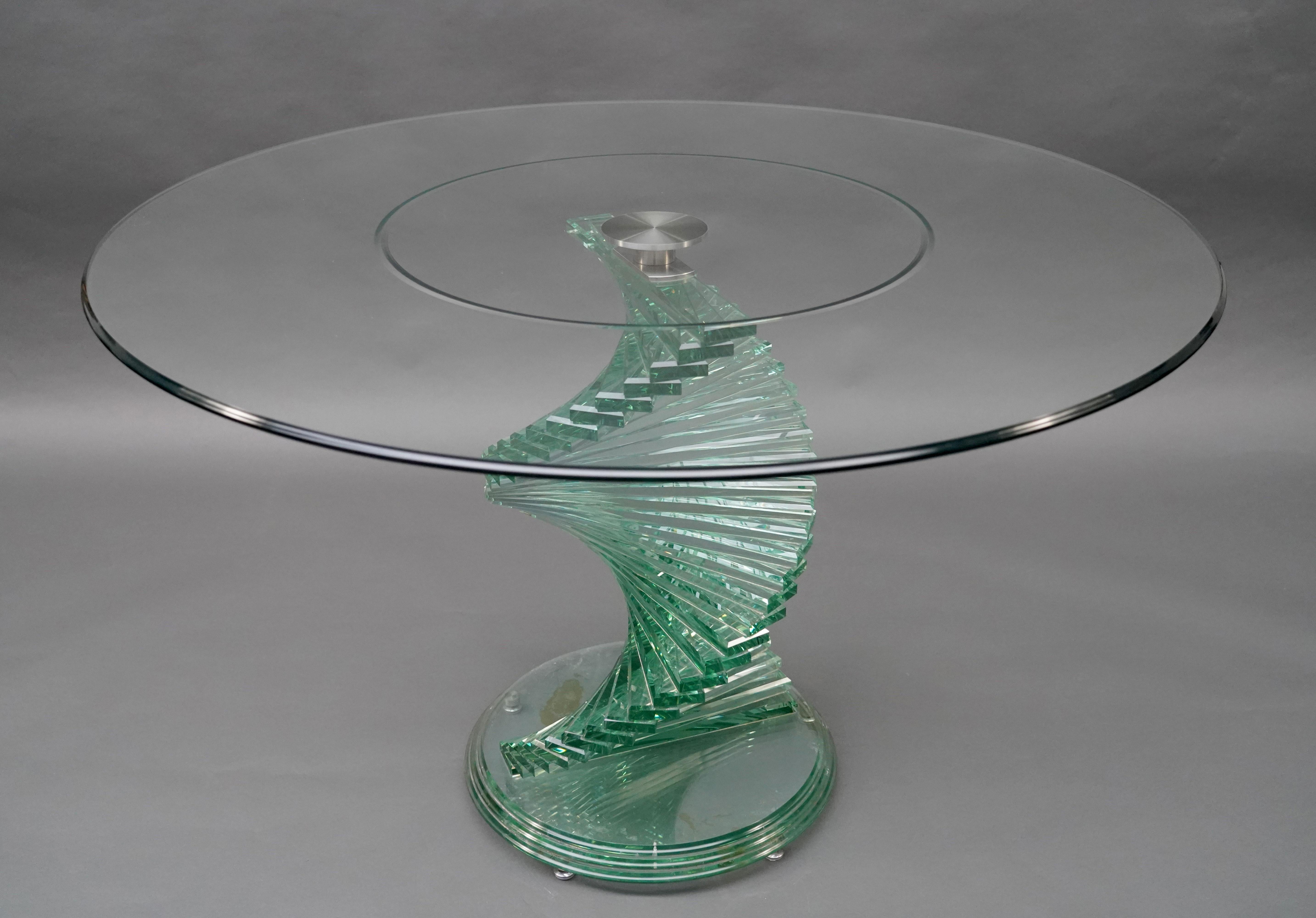 Beautiful vintage oval table inspired by the style of Danny Lane, in stacked glass with removable top. 
The unique design of the helical spiral table leg, with carefully stacked glass rectangles, creates a striking aesthetic. 
Moreover, the oval