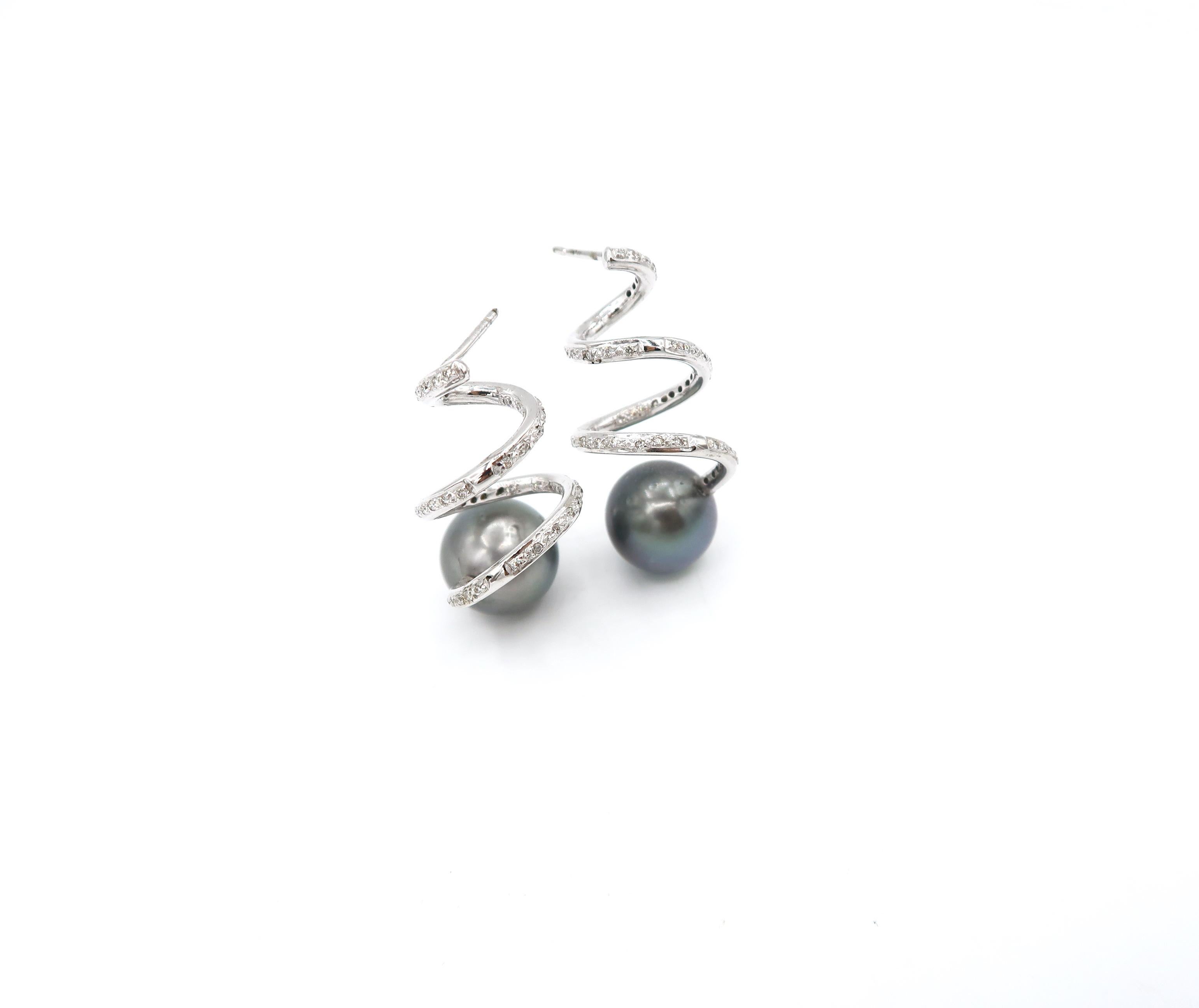 Helix Twirl Diamond Pavé Earrings in 18K White Gold with Tahitian Pearl Tips

Pearl: 13mm 
Diamond: 0.78ct.
Gold: 18K Gold 14.42g.