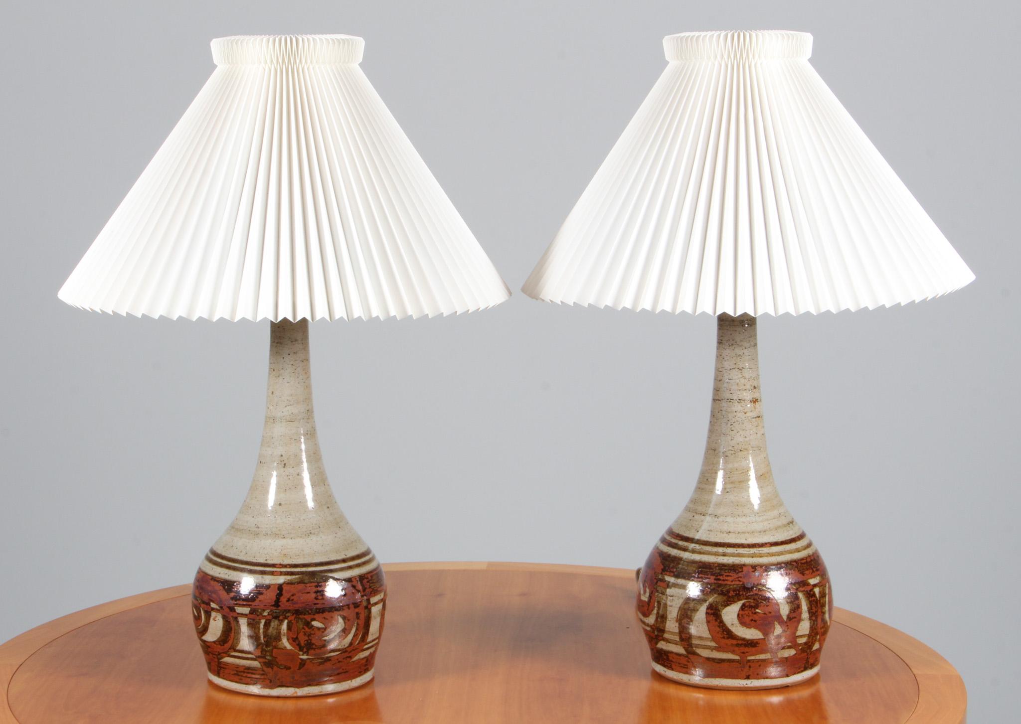 Helle Allpass pair of table lamps in partly glazed stoneware.

Le klint shade with minor marks.