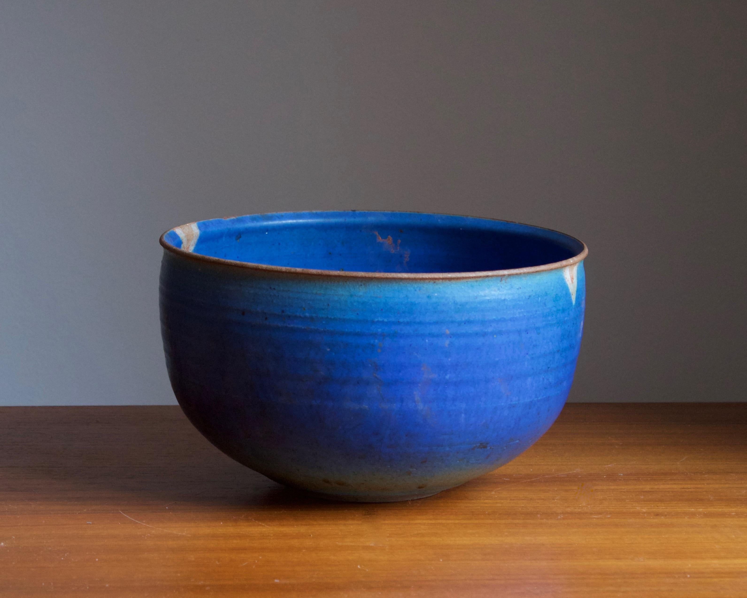 A sizable bowl designed and produced by Helle Allpass in her studio, Denmark, 1960s. Features a highly artistic glaze. Stamped.

 