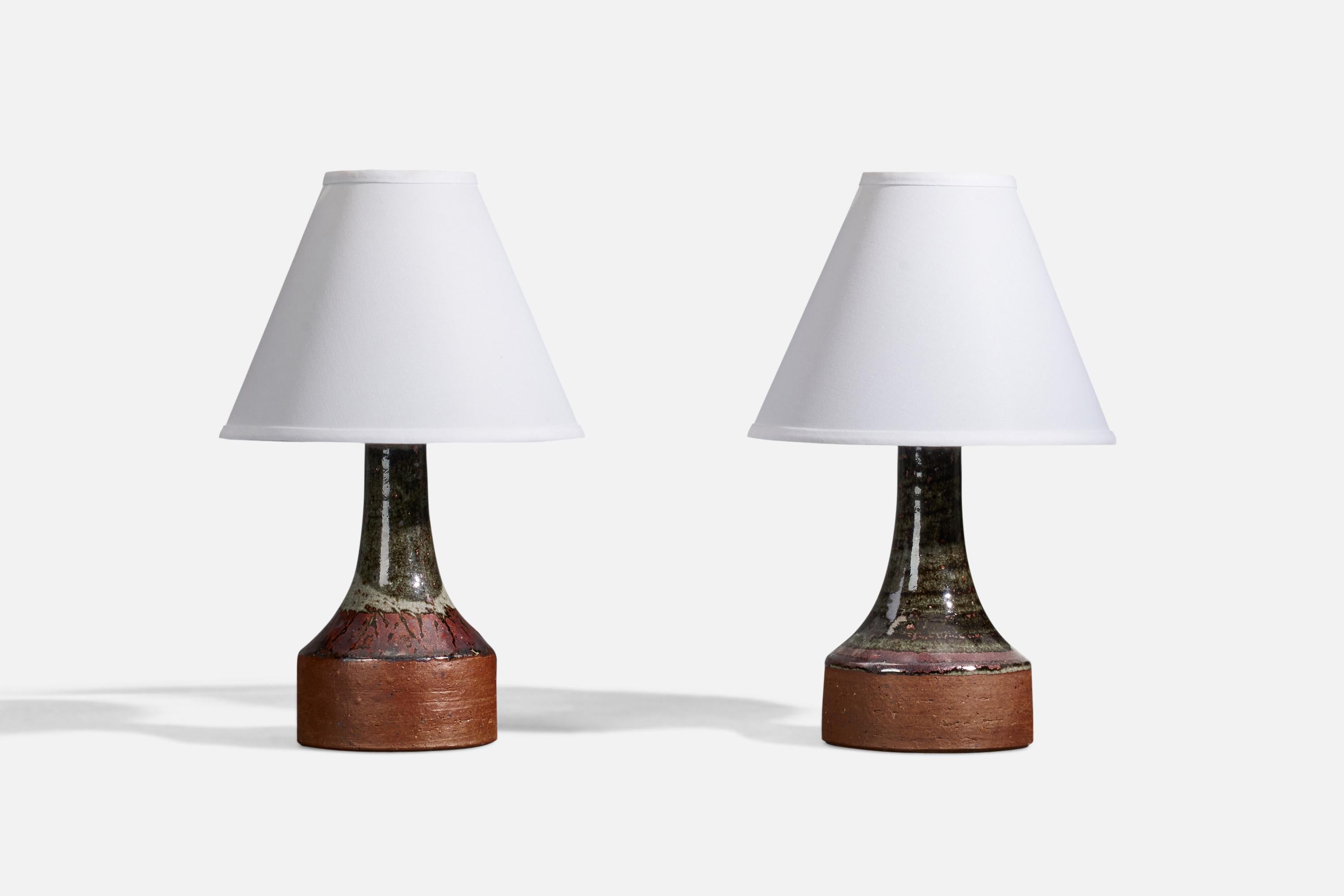 A pair of table lamps designed and produced by Helle Allpass in her studio, Denmark, 1960s. Stamped.

Stated dimensions exclude lampshades. Height includes socket. 

Glaze features brown-green colors.

Dimensions of Lamp (inches) : 11.62 x 5.83 x