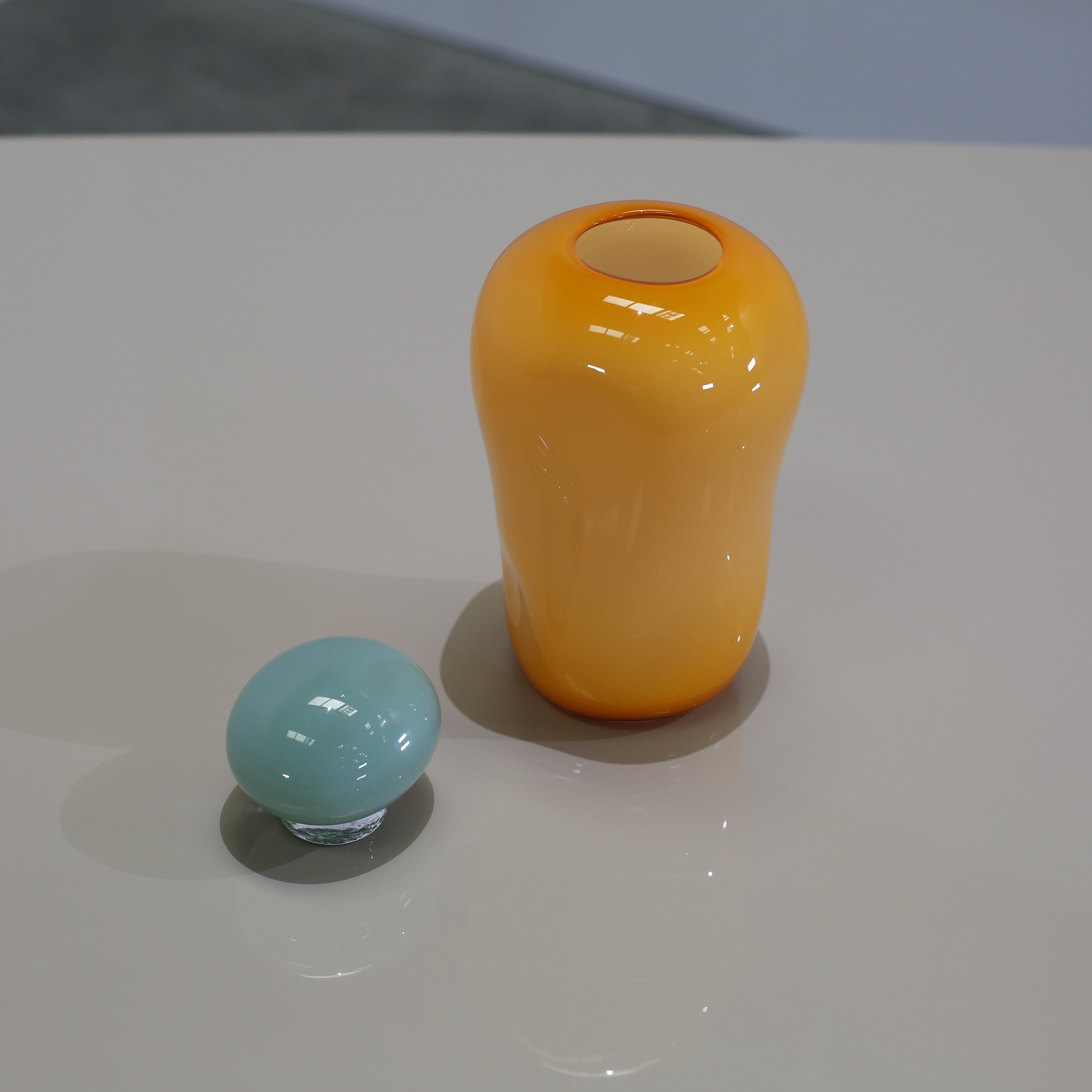 Helle Mardahl's Bon Bon Mega Vase is a delightful fusion of sculptural elegance and whimsical charm. Meticulously crafted in Denmark, each piece is a unique work of art, with natural variations in shape and colour. Inspired by childhood nostalgia