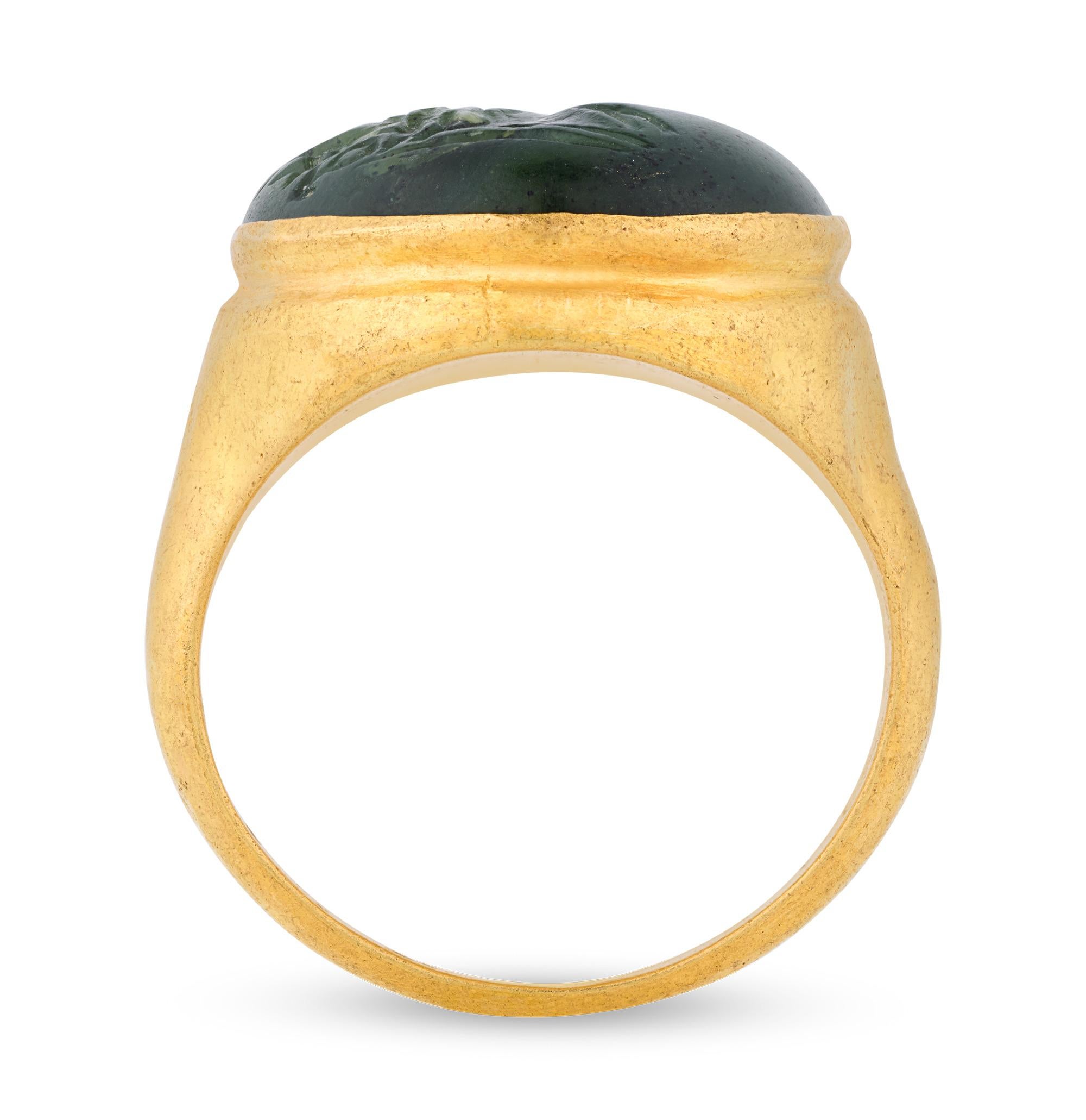 A remarkable artifact of classical antiquity, this Hellenistic ring displays a finely carved intaglio in the likeness of Aphrodite, the Greek goddess of love and beauty. Rendered in rich green jade nephrite—a material exceptionally rare in classical
