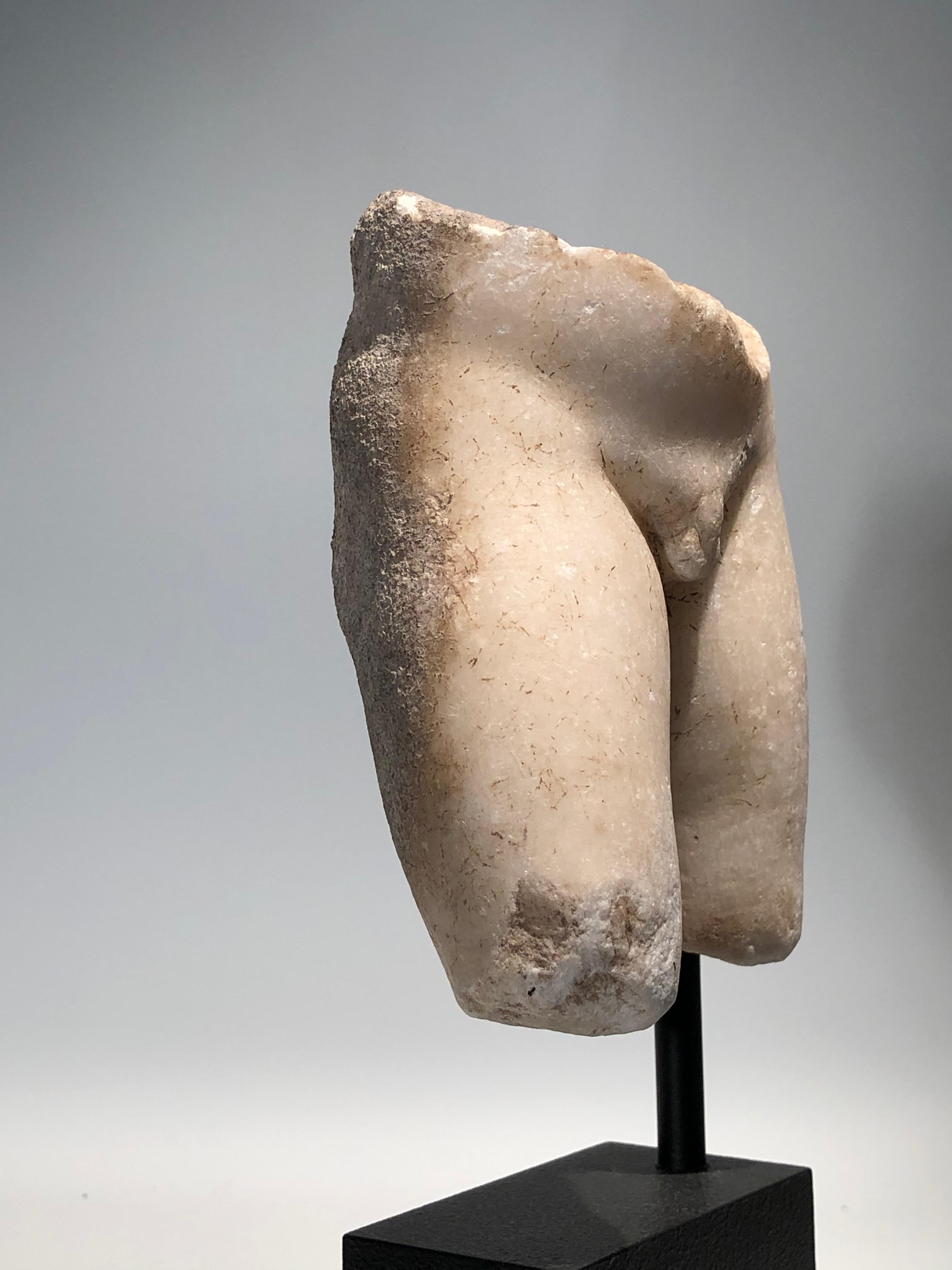 Attractive marble torso of a young male, member of an agile group of figures (ensemble). Rhodes, Hellenistic period, circa 150 BC.
Provenance ex private collection Munich, early 20th century.
   