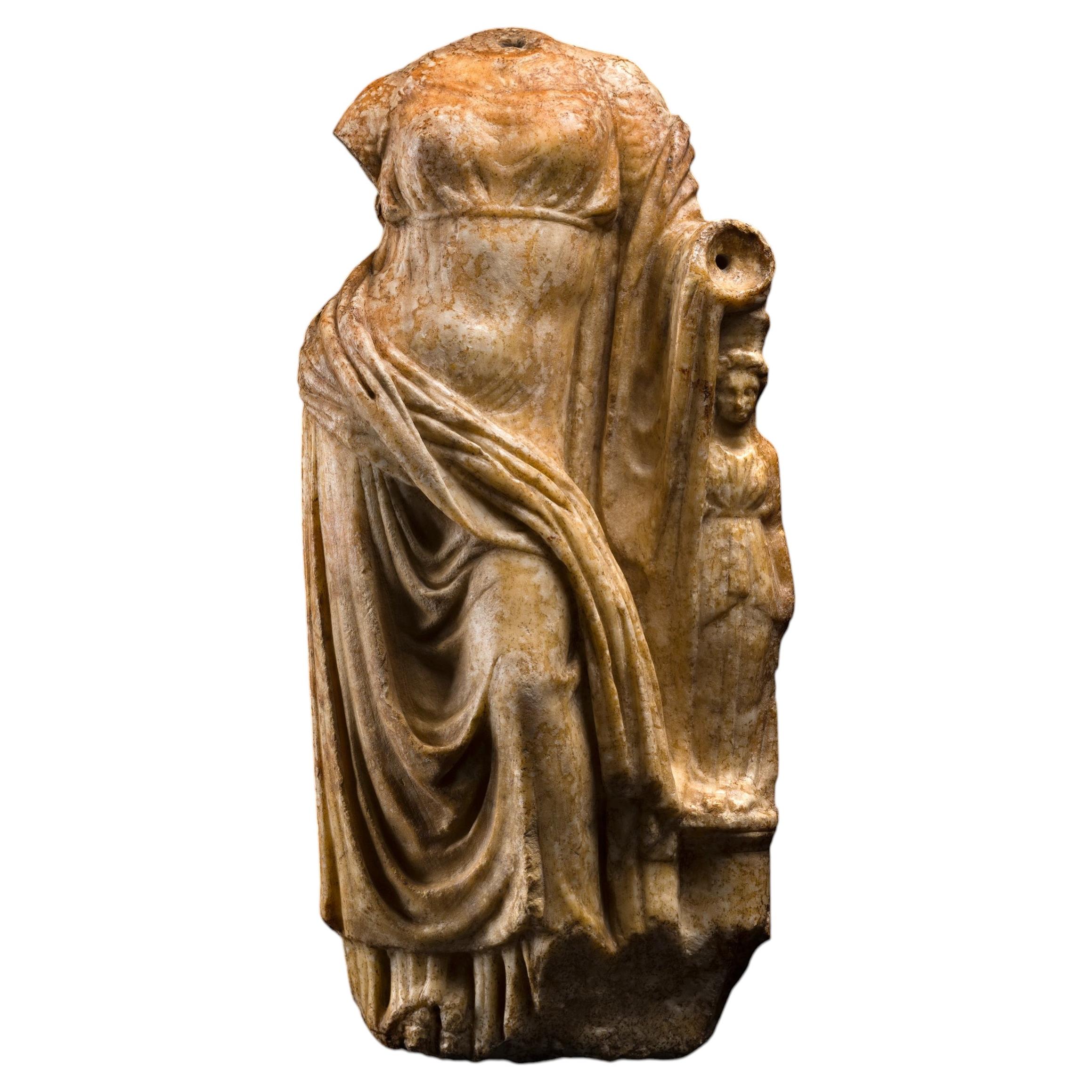 Hellenistic Sculpture of the goddess Aphrodite reclining on an idol in marble