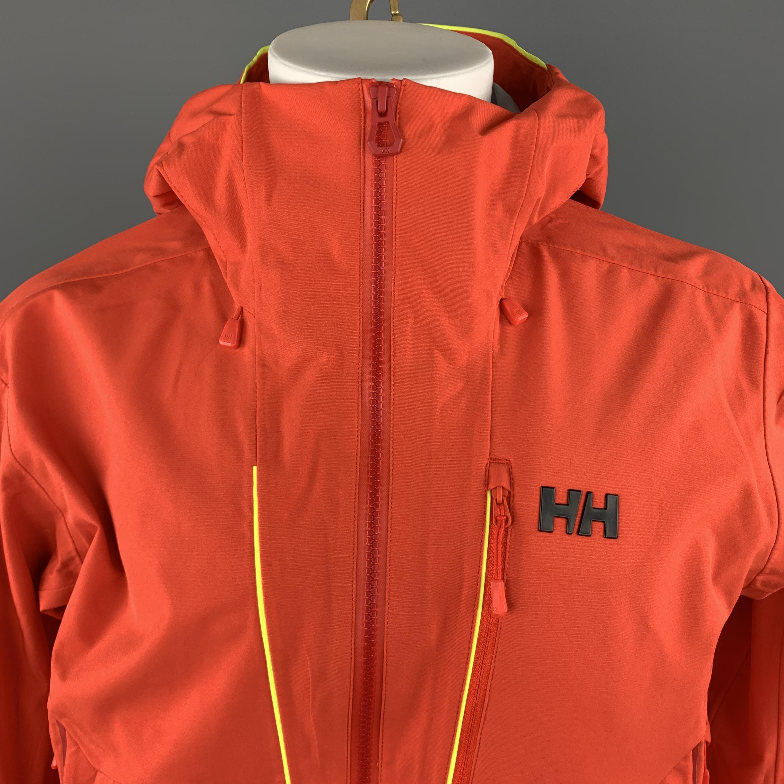 HELLY HANSON ski jacket comes in bold orange water poof material with yellow piping, multiple zip pockets throughout, hand sleeve cuffs, and cap hood. 

Excellent Pre-Owned Condition.
Marked: M

Measurements:

Shoulder: 21 in.
Chest: 50 in.
Sleeve: