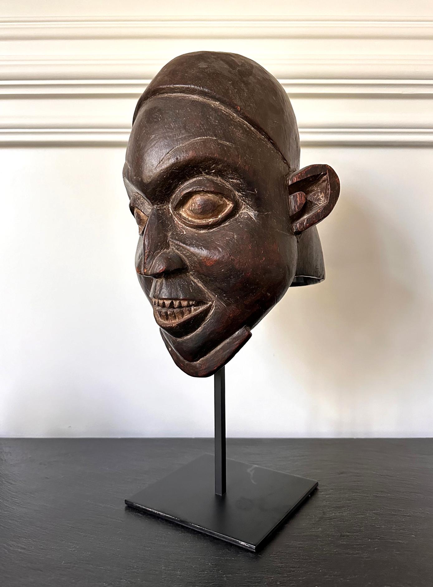 This Helmet Crest mask is categorized as a “Babanki” style Ngoin mask from Northwestern provinces of Cameroon circa first half of 20th century. In part of highland area called “Cameroon Grassfield”, Ngoin masks are among an ensemble of over 20 masks