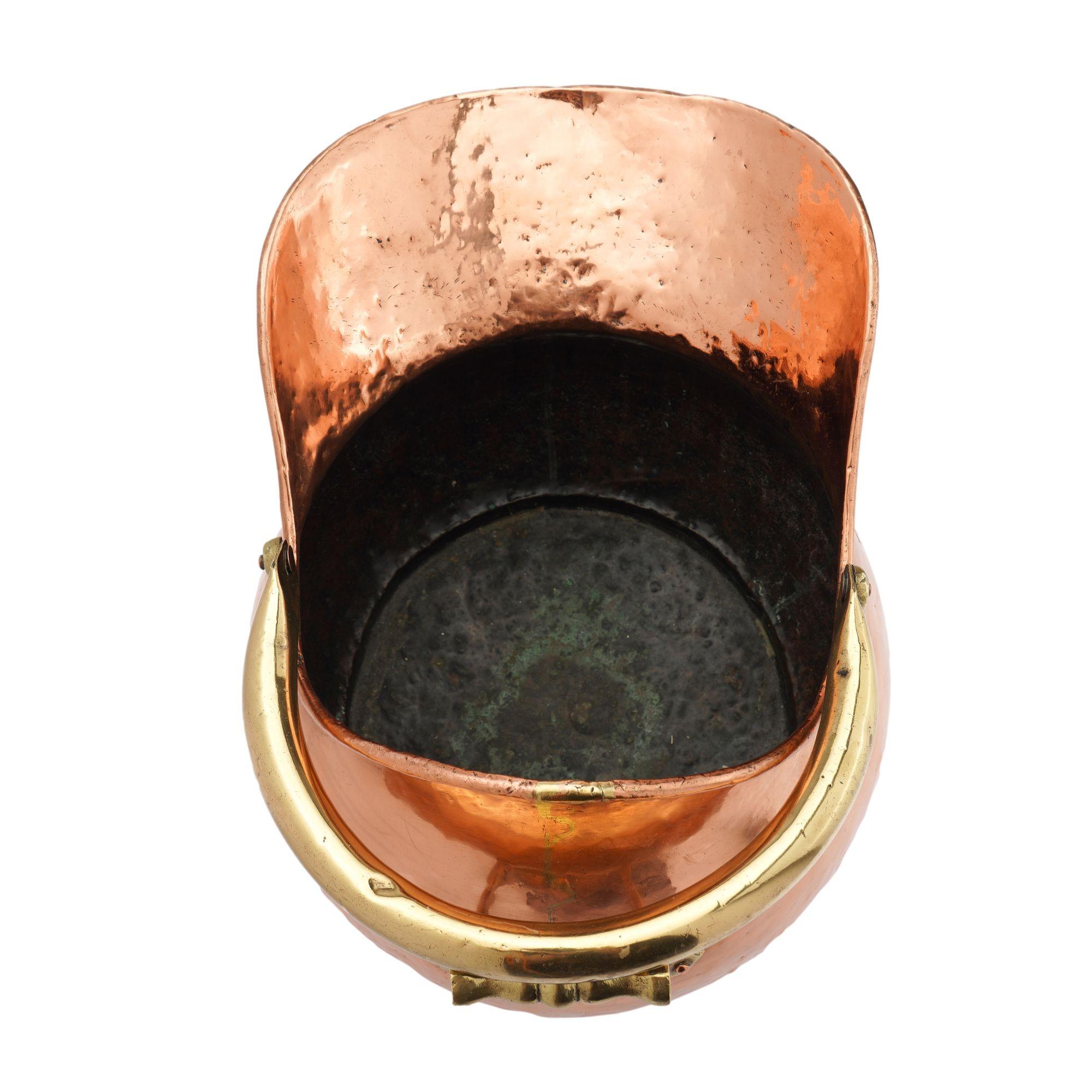 Helmet shaped copper coal hod on a circular footed base, 1800's For Sale 14