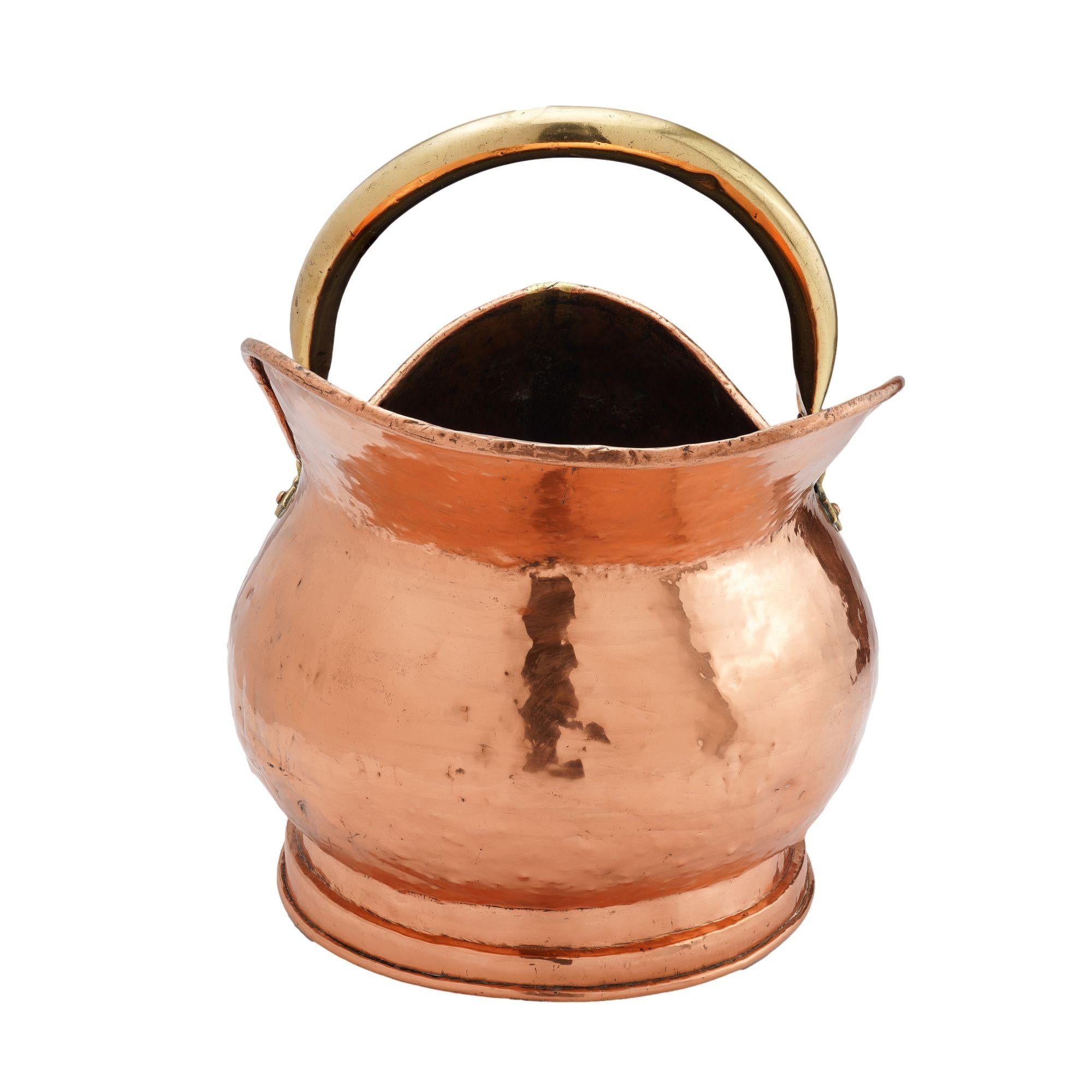 19th Century Helmet shaped copper coal hod on a circular footed base, 1800's For Sale