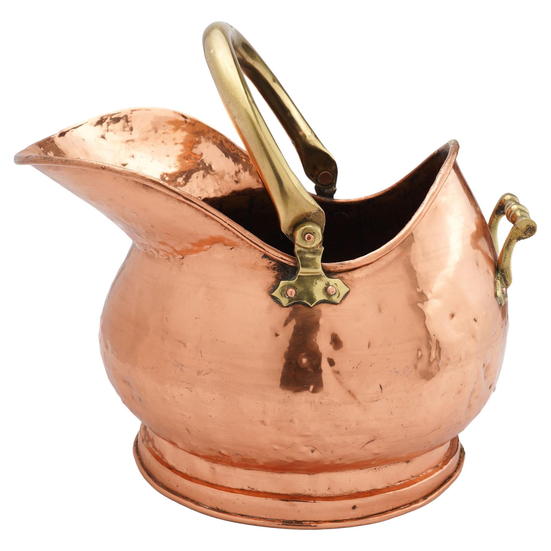 Helmet shaped copper coal hod on a circular footed base, 1800's For Sale