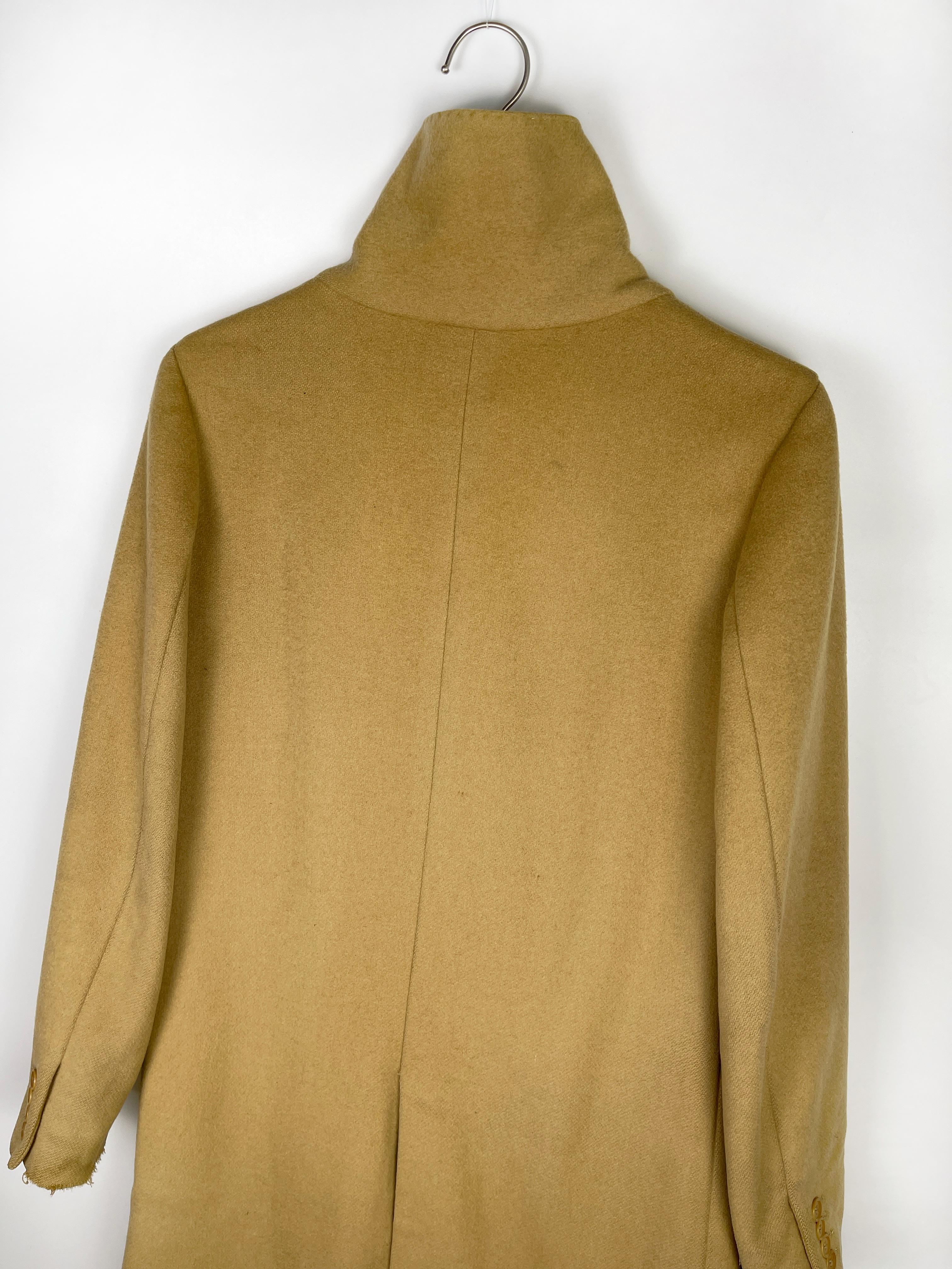 Vintage coat from Helmut Lang, the tag signified that the coat was produced in the 1980's. 

Size: Not listed, the item fits like a size Small or up to a slim Medium,

Condition: 7/10. There are scratches on the sleeve, and a sew spot on the