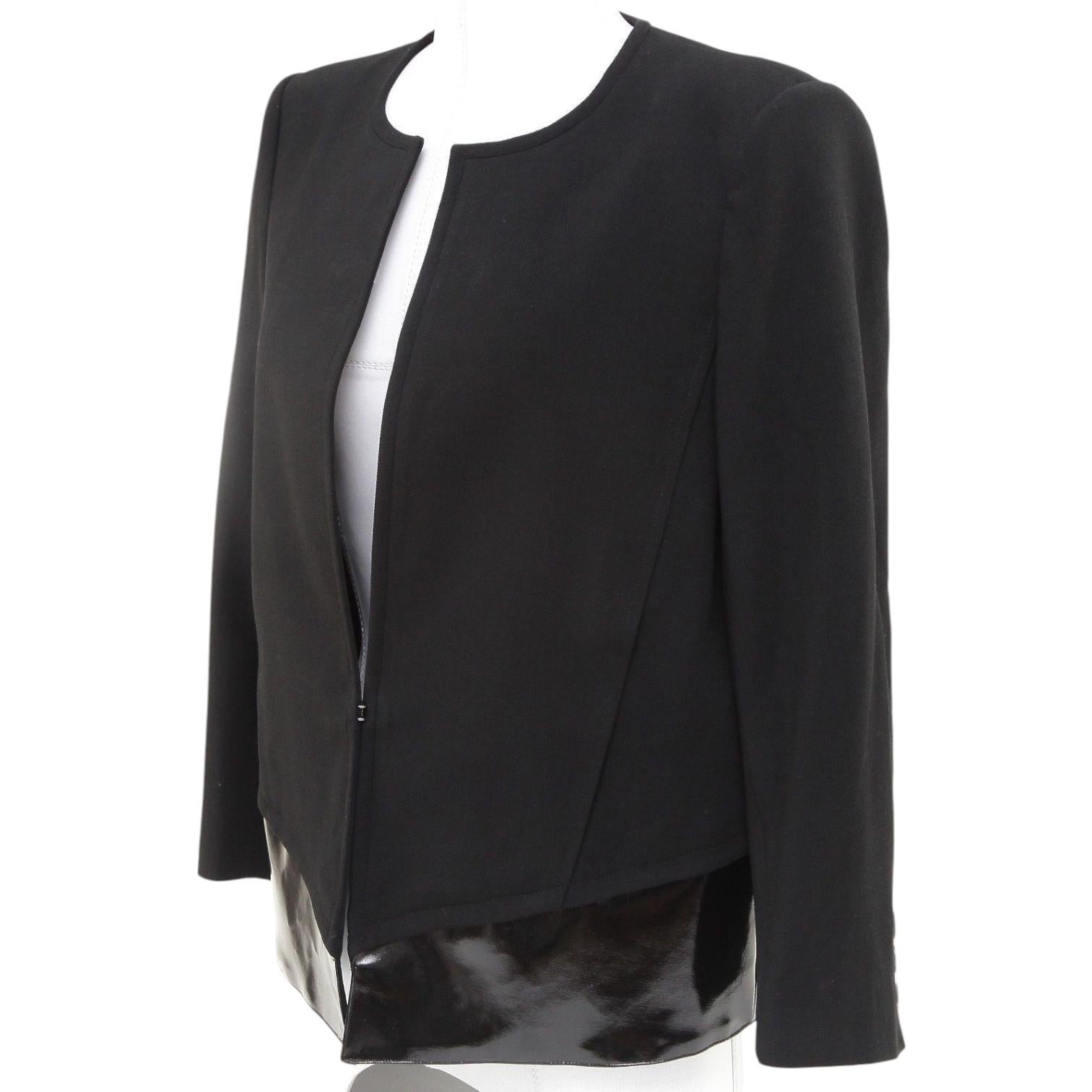 GUARANTEED AUTHENTIC HELMUT LANG LONG SLEEVE BLAZER

 Details:
 • Long sleeve black boxy style jacket.
 • Collarless.
 • Faux patent leather detail at bottom of jacket.
 • Front hook and eye closure.
 • Fully lined.

 Fabric: 58% Angora, 38%
